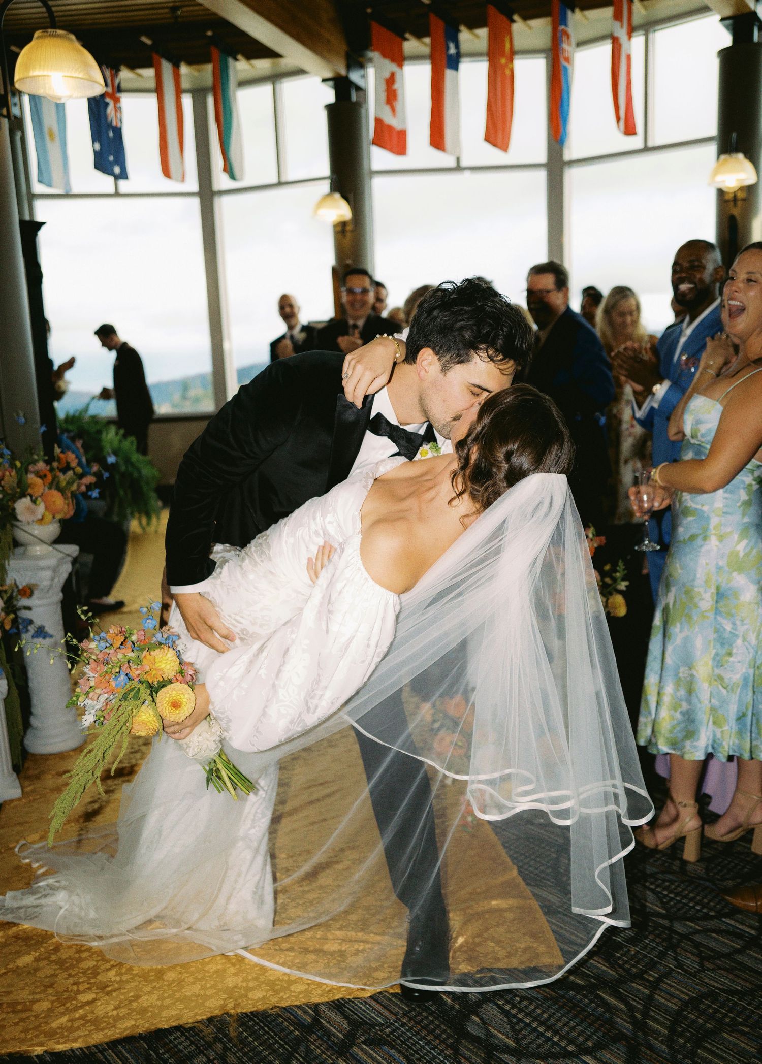 Wedding dance sequence showing couple performing dramatic dips on a decorated dance floor.