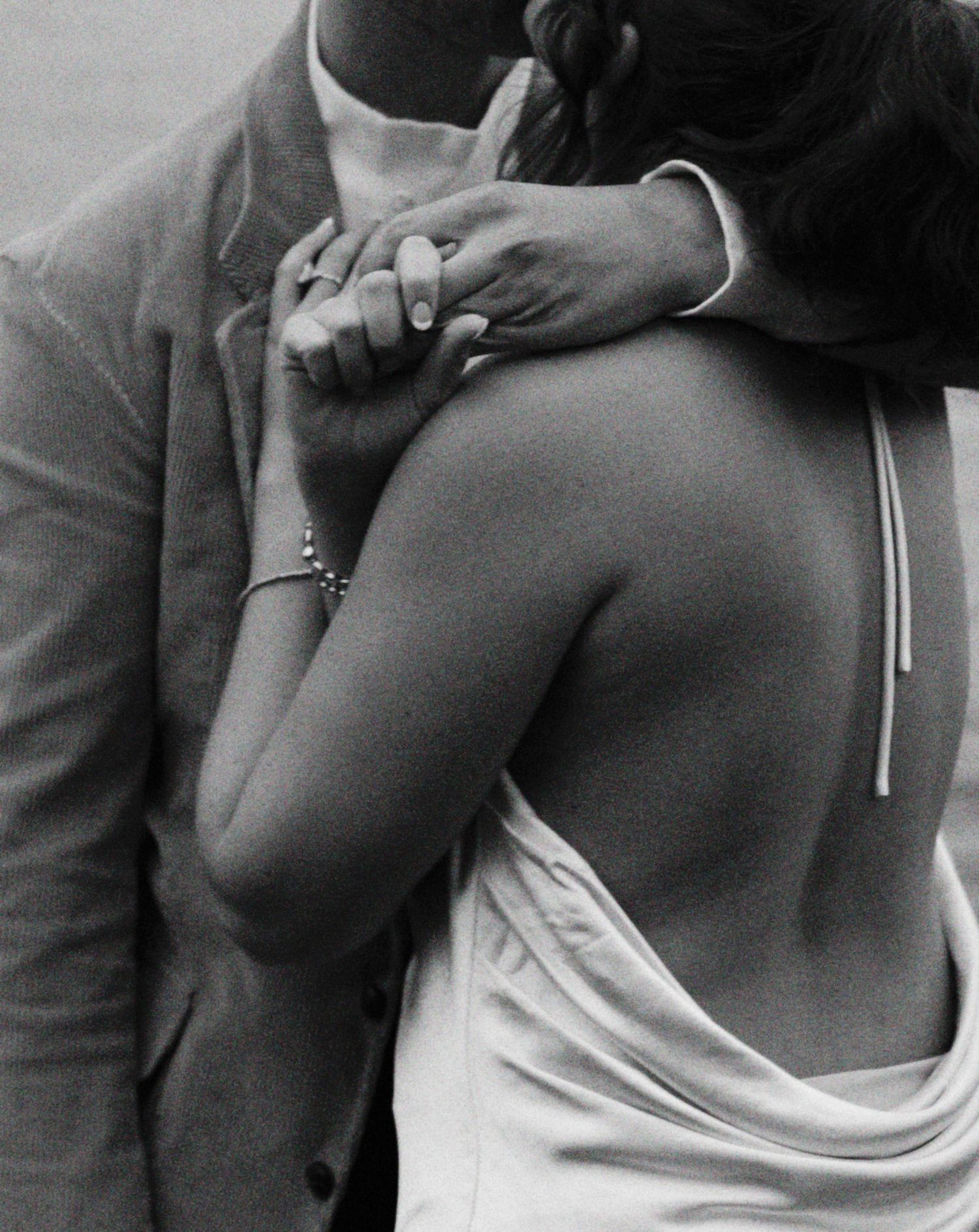 Black and white artistic portrait sequence showing a person's neck and shoulders in a white tank top.