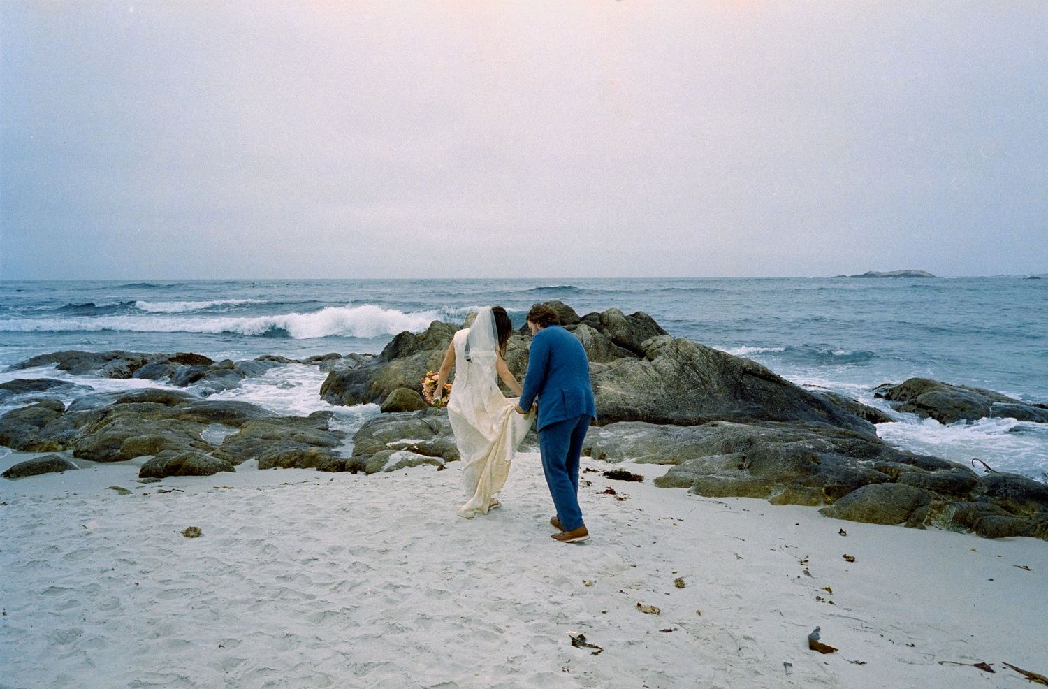 A series of coastal photographs showing rocky shores, crashing waves, and people exploring the rugged oceanfront terrain.
