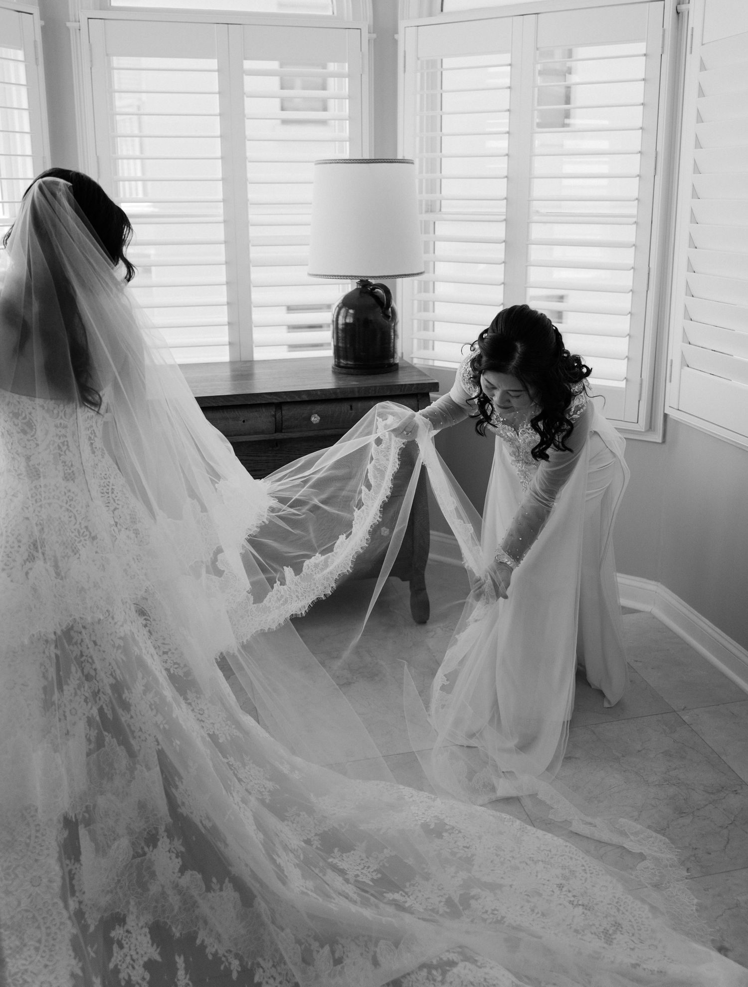 A series of wedding dress photos showing the flowing movement of white lace and tulle veils in natural window light.