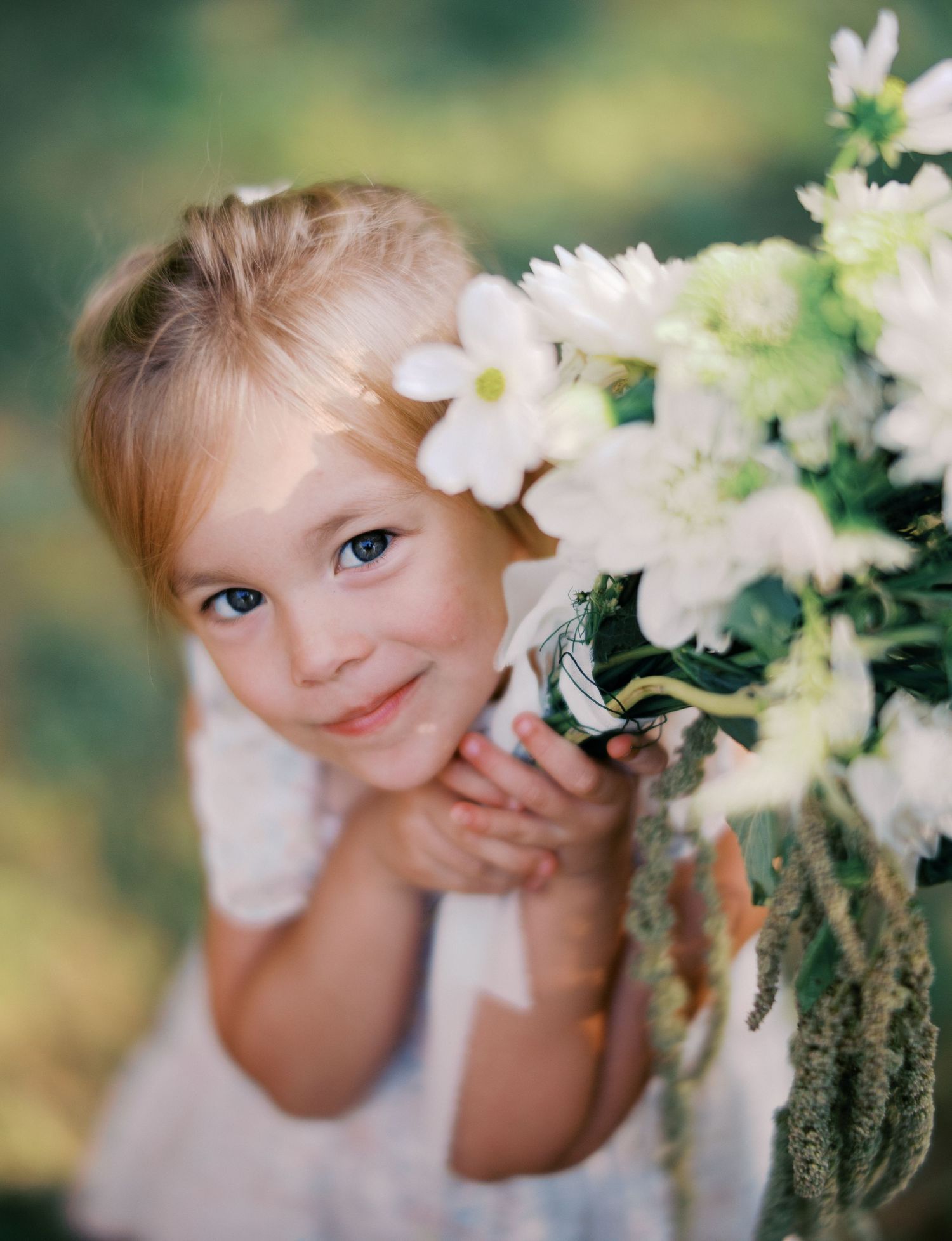White daisies frame a playful moment in a garden setting.