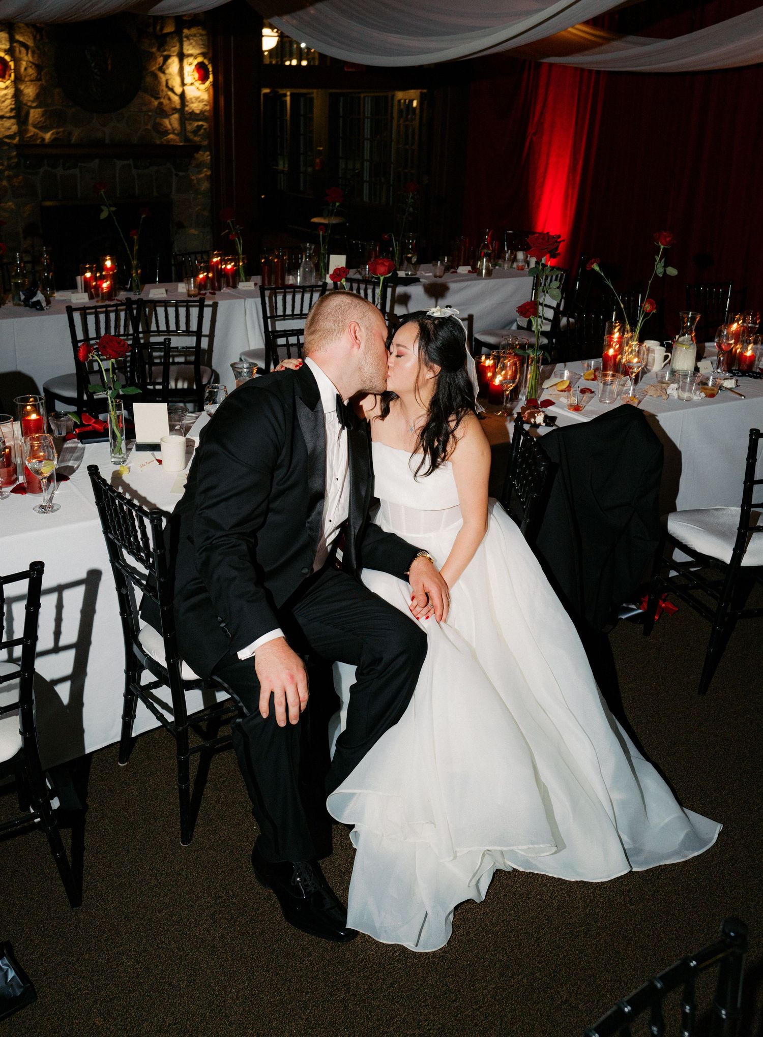 Wedding reception dance floor scene with elegant decor and formal attire.