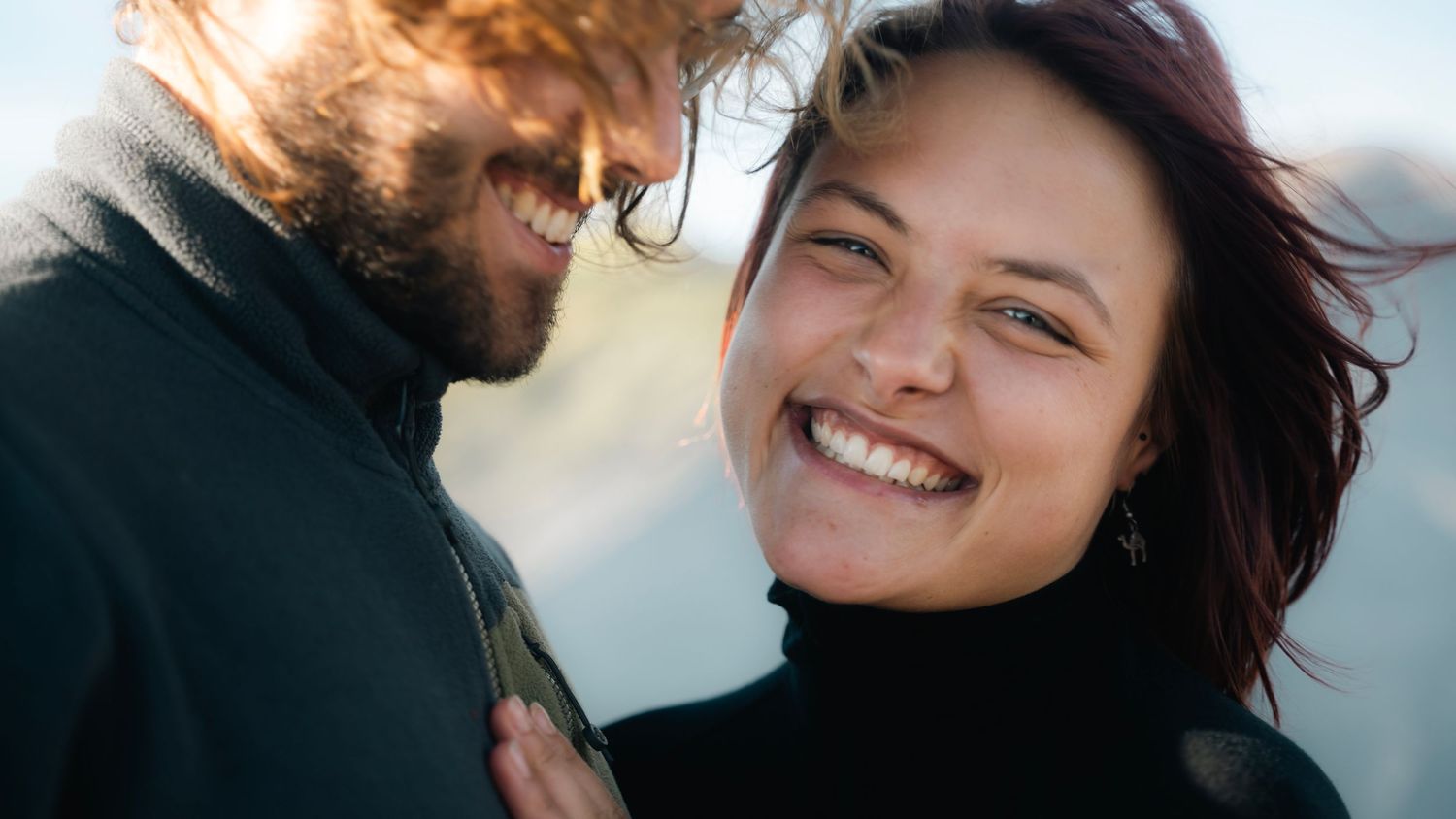 A sequence of close-up shots showing a couple embracing and sharing intimate moments against a bright background.