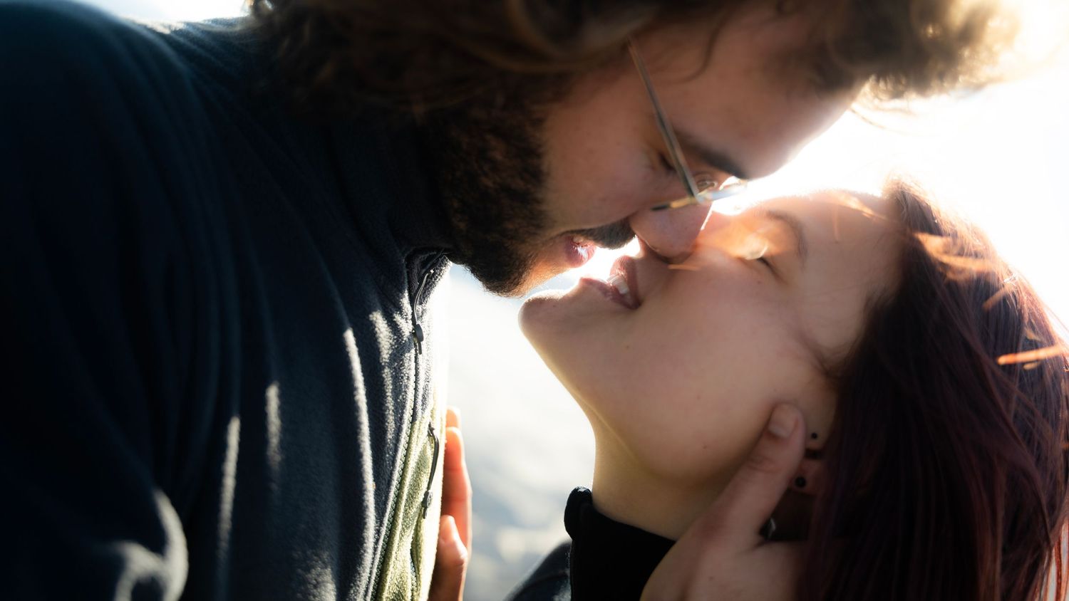 A series of six intimate silhouetted images showing tender romantic moments between a couple.