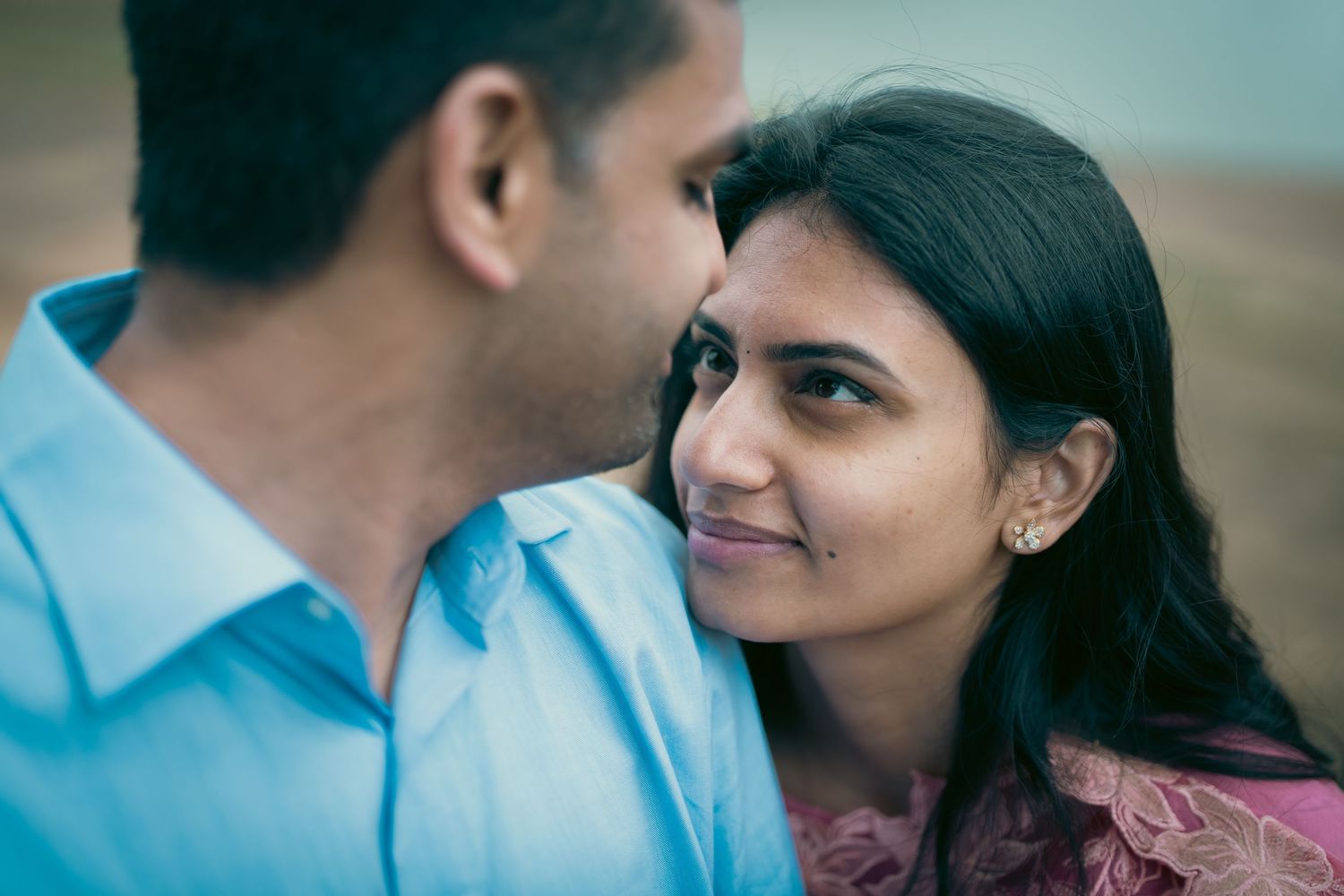Candid close-up shot of a couple during their engagement photoshoot.