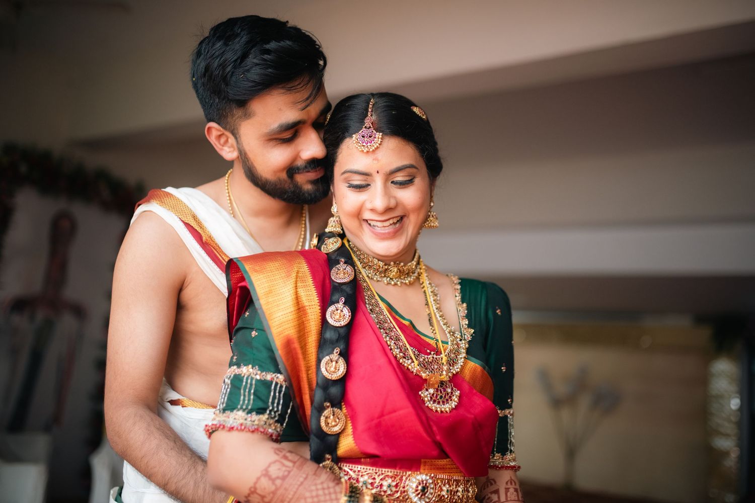 A collection of tender moments between a couple in traditional South Indian wedding attire during their celebration.