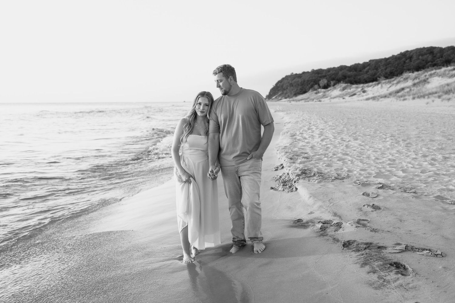Series of beachside photos capturing tender moments between two people at dusk.