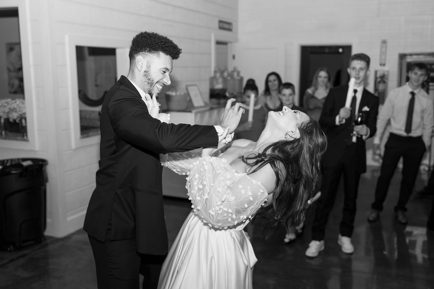 Newlyweds share a romantic dance moment during their wedding reception.