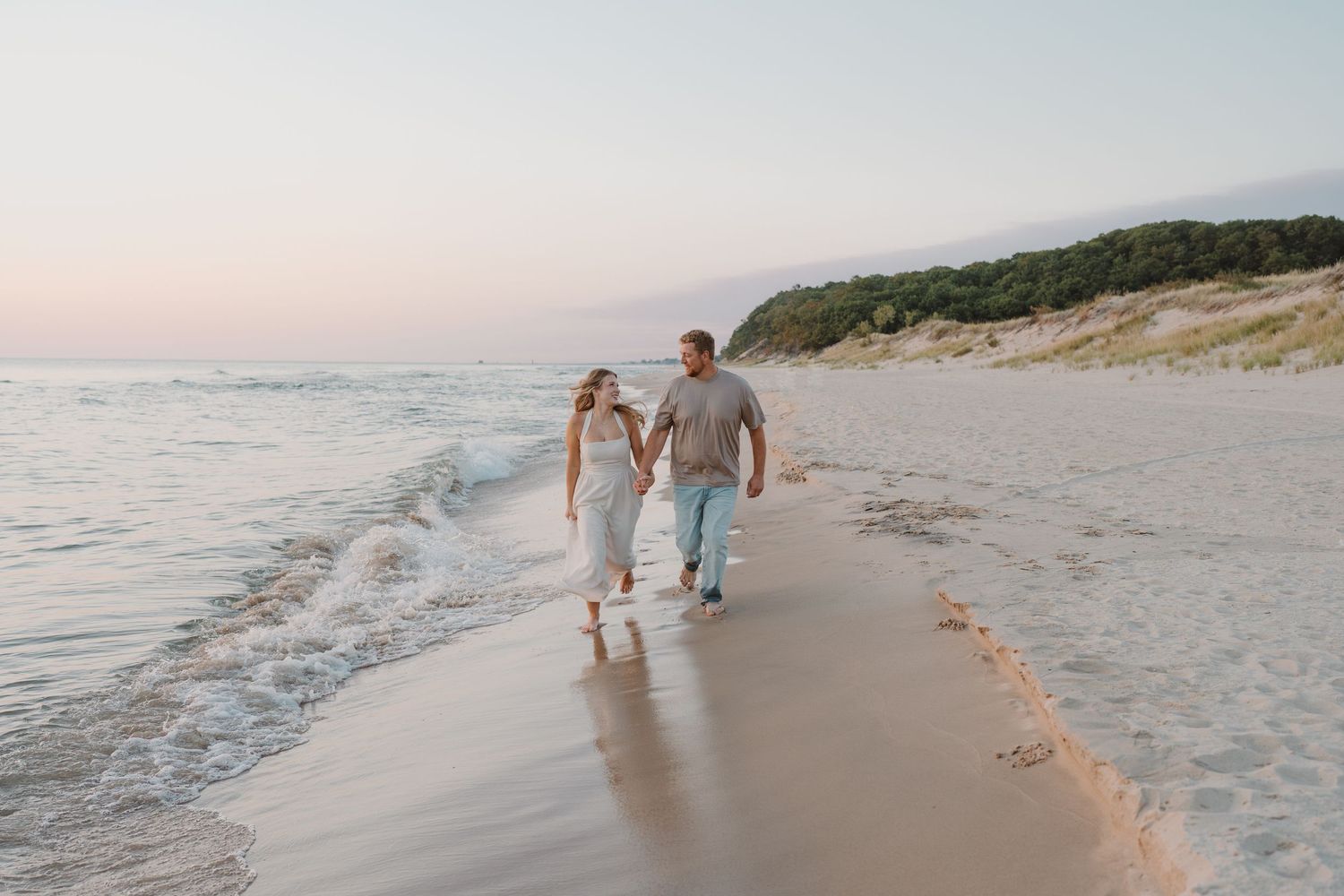 Beachside moment captured during sunset with waves lapping at the shore.