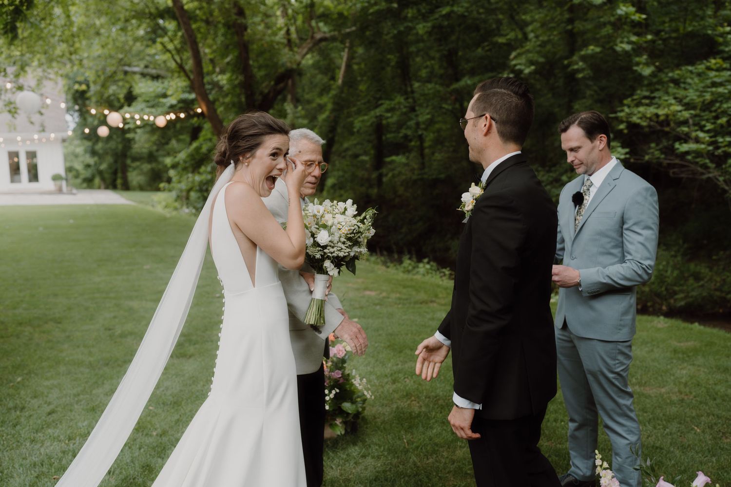 Wedding celebration moment captured in a scenic garden setting with elegant floral decorations.