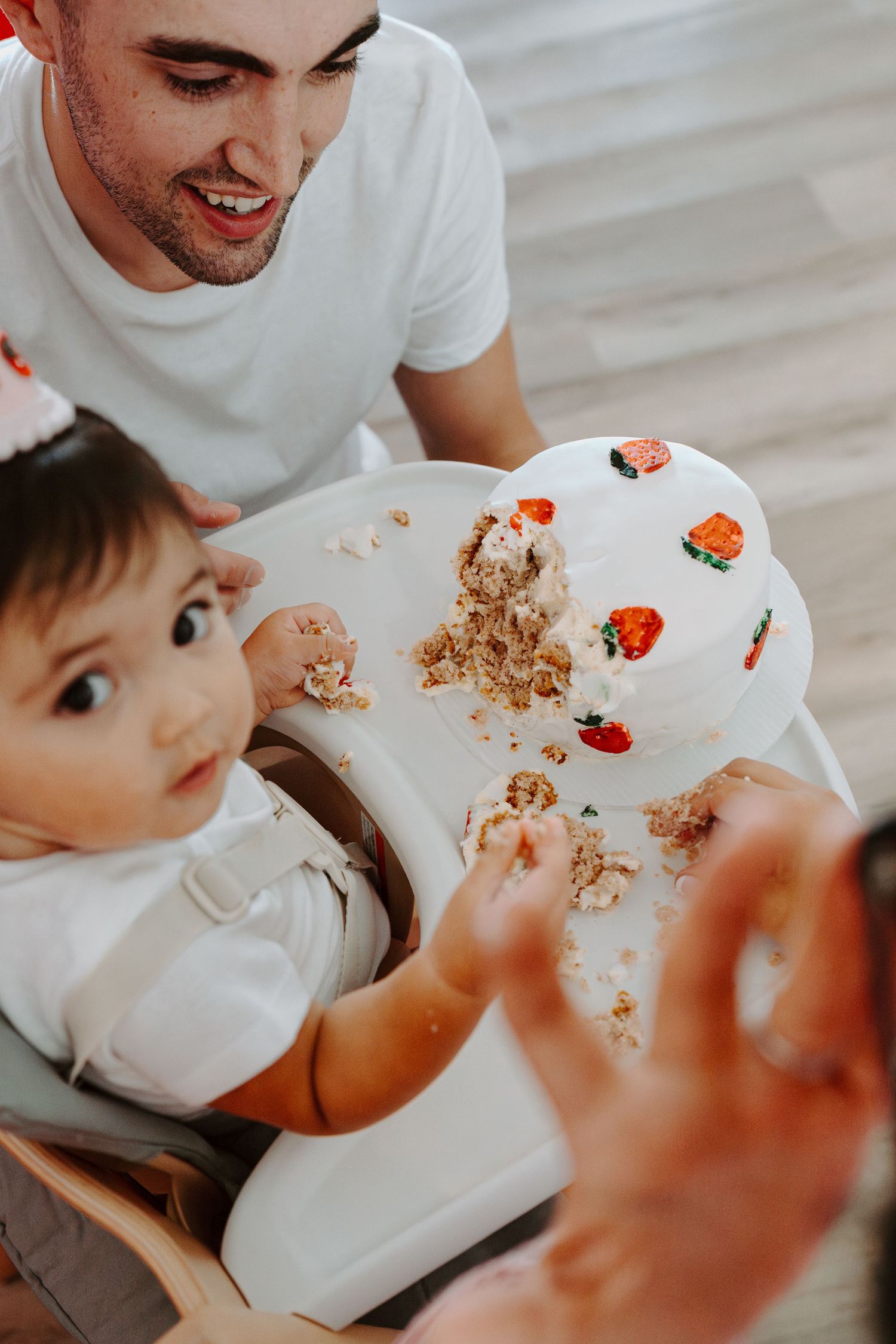 Close-up shots of a messy cake eating session showing crumbs and frosting.