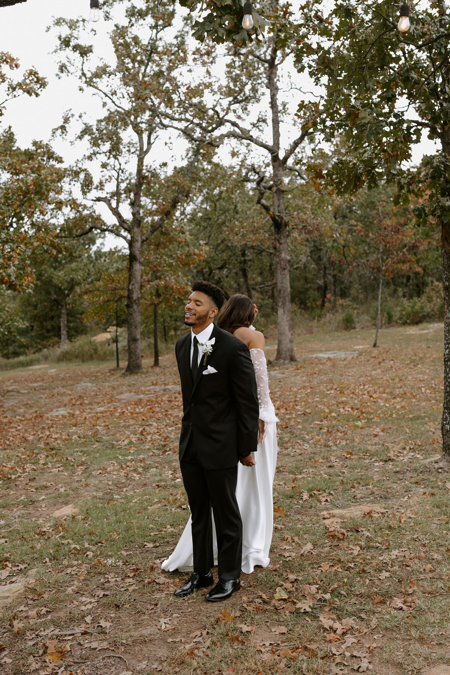 A couple shares an intimate moment during their autumn wedding photoshoot.