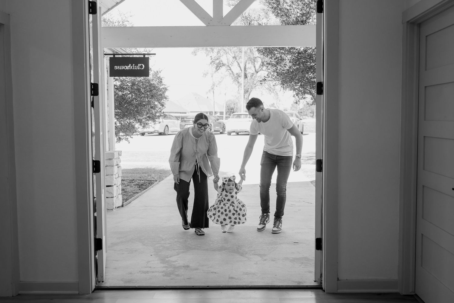 Interior view looking out through glass doors to a covered entryway.
