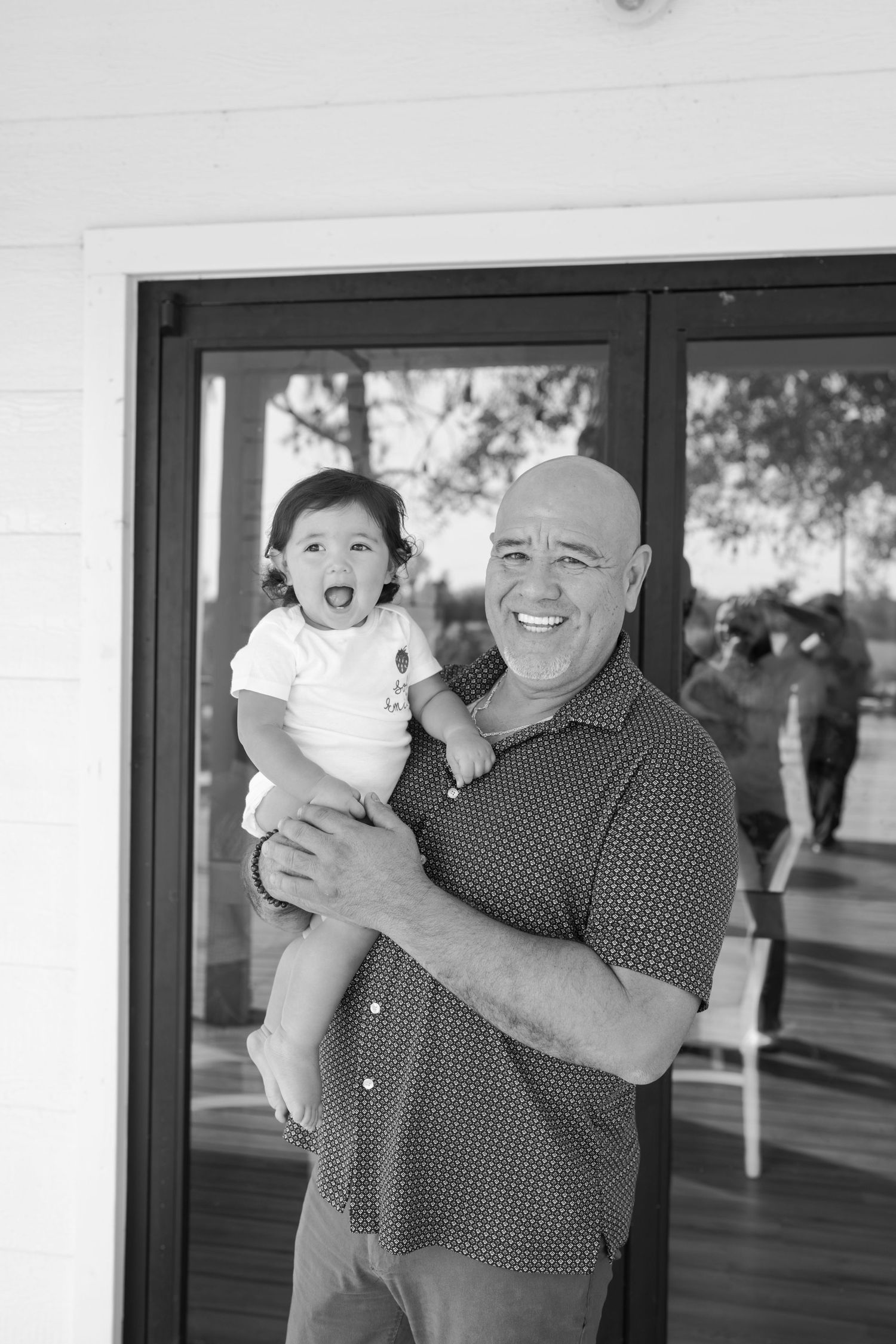 Black and white outdoor portrait session with joyful expressions.