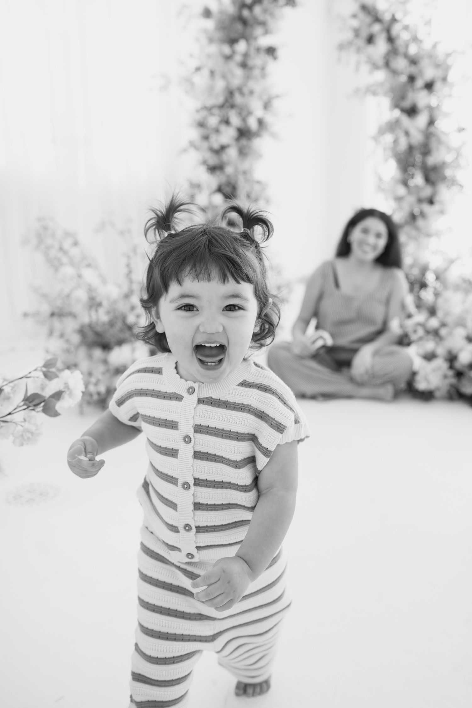 Series of black and white photos capturing energetic movement in a studio setting.