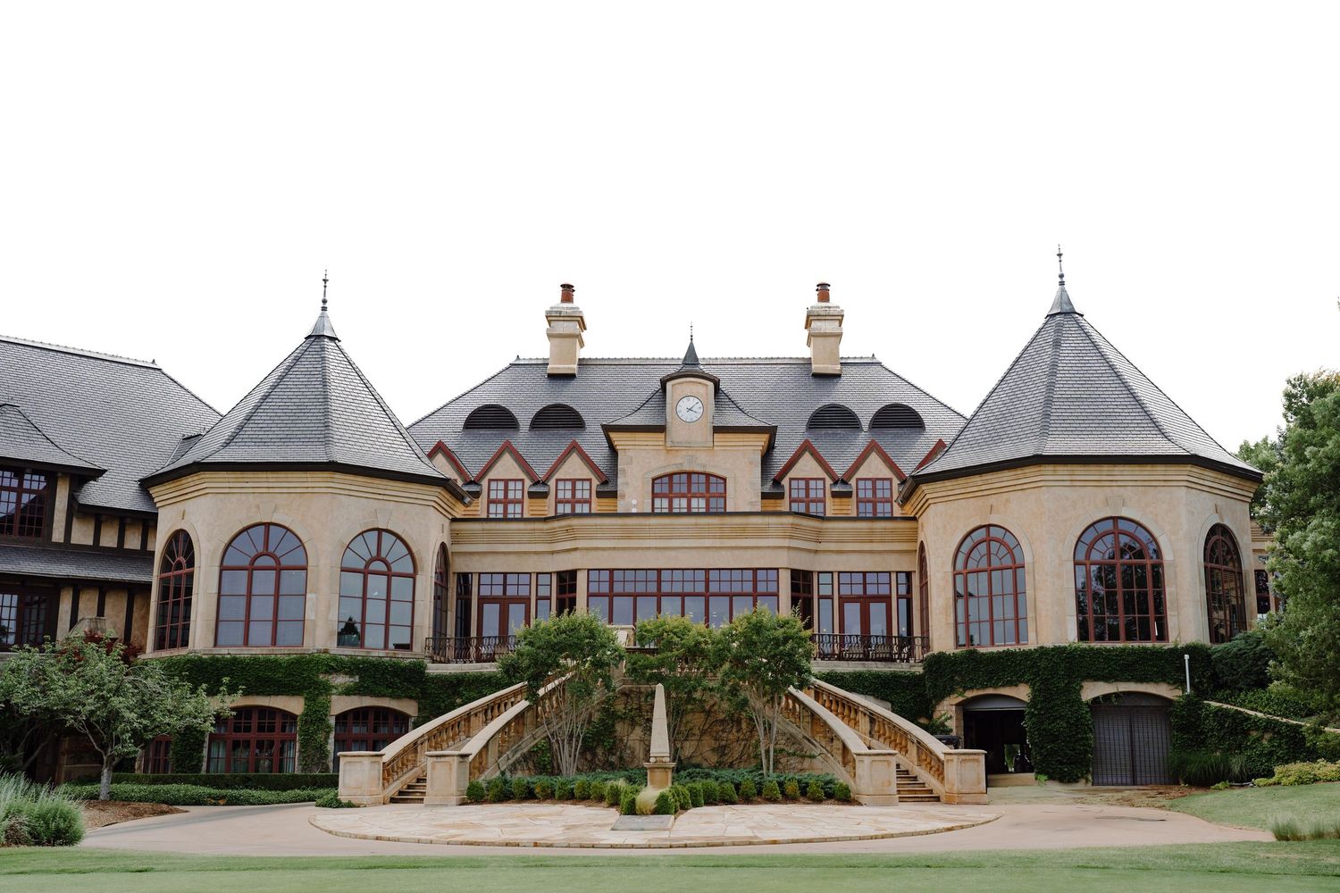 Luxurious French country style mansion with multiple gabled roofs and arched windows viewed from different angles.