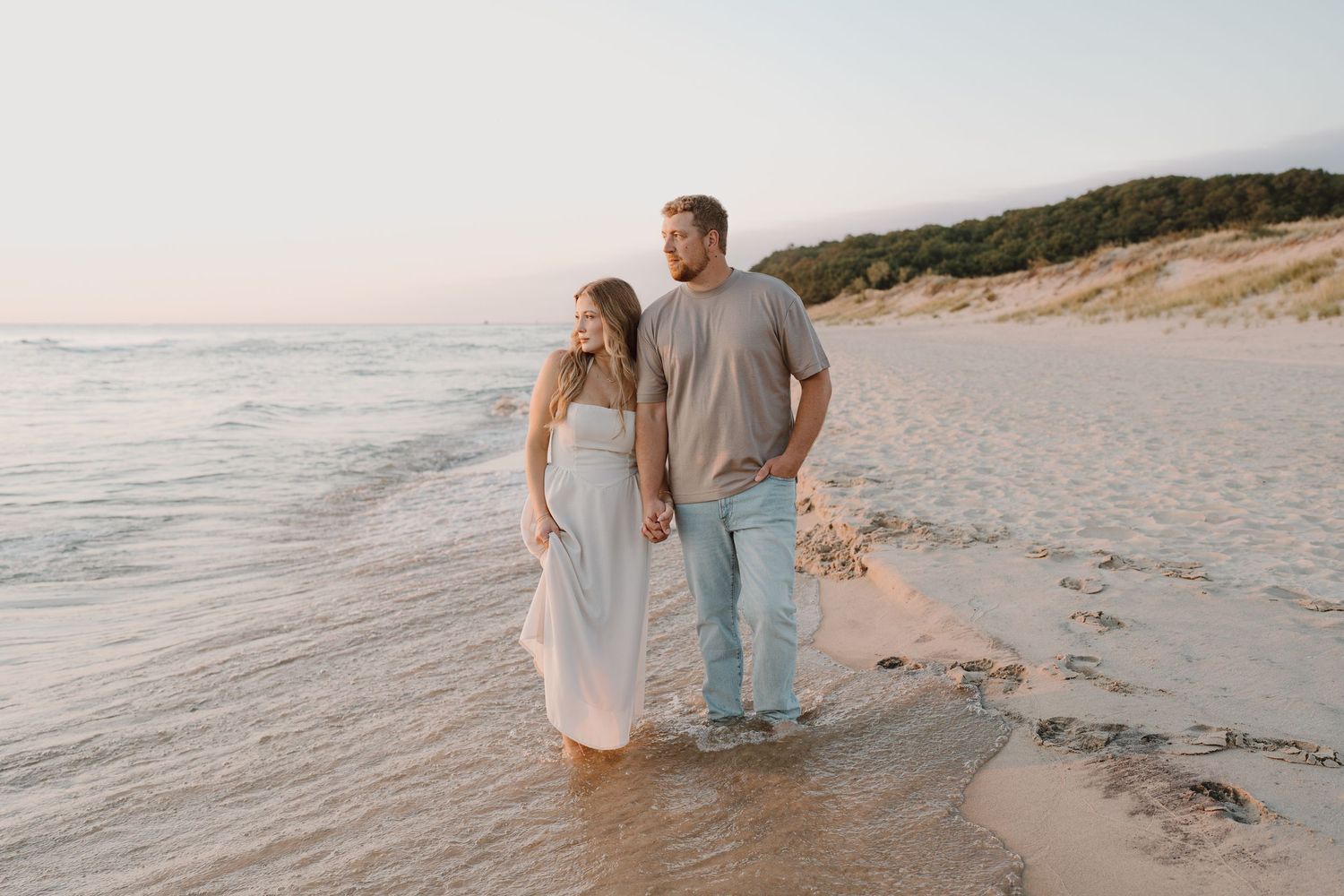 Multiple shots of a beach scene showing a couple enjoying a peaceful walk by the ocean.