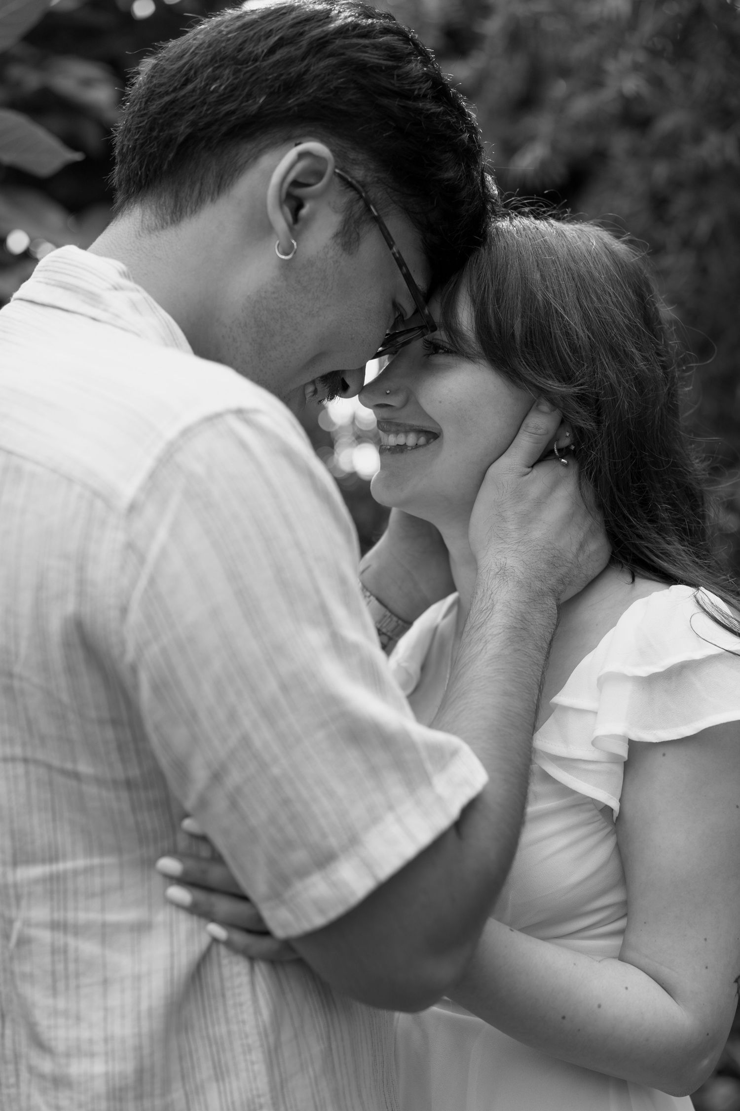 Intimate black and white portraits capturing tender moments between a couple.