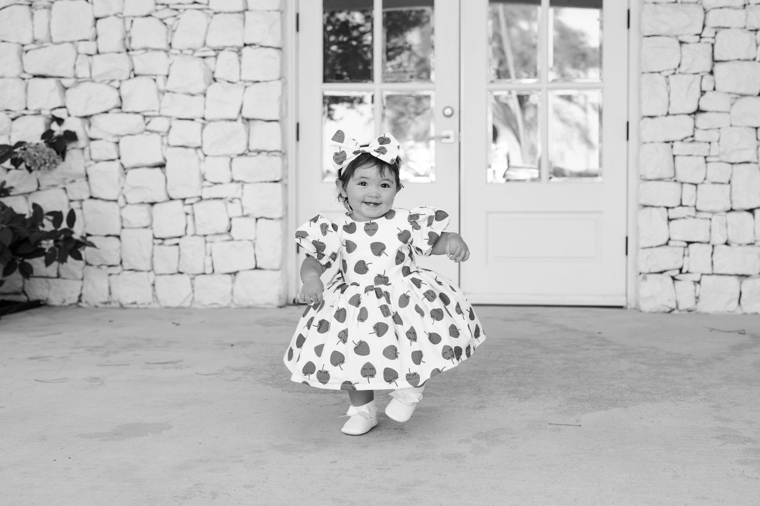Series of candid family photos against white brick wall background.