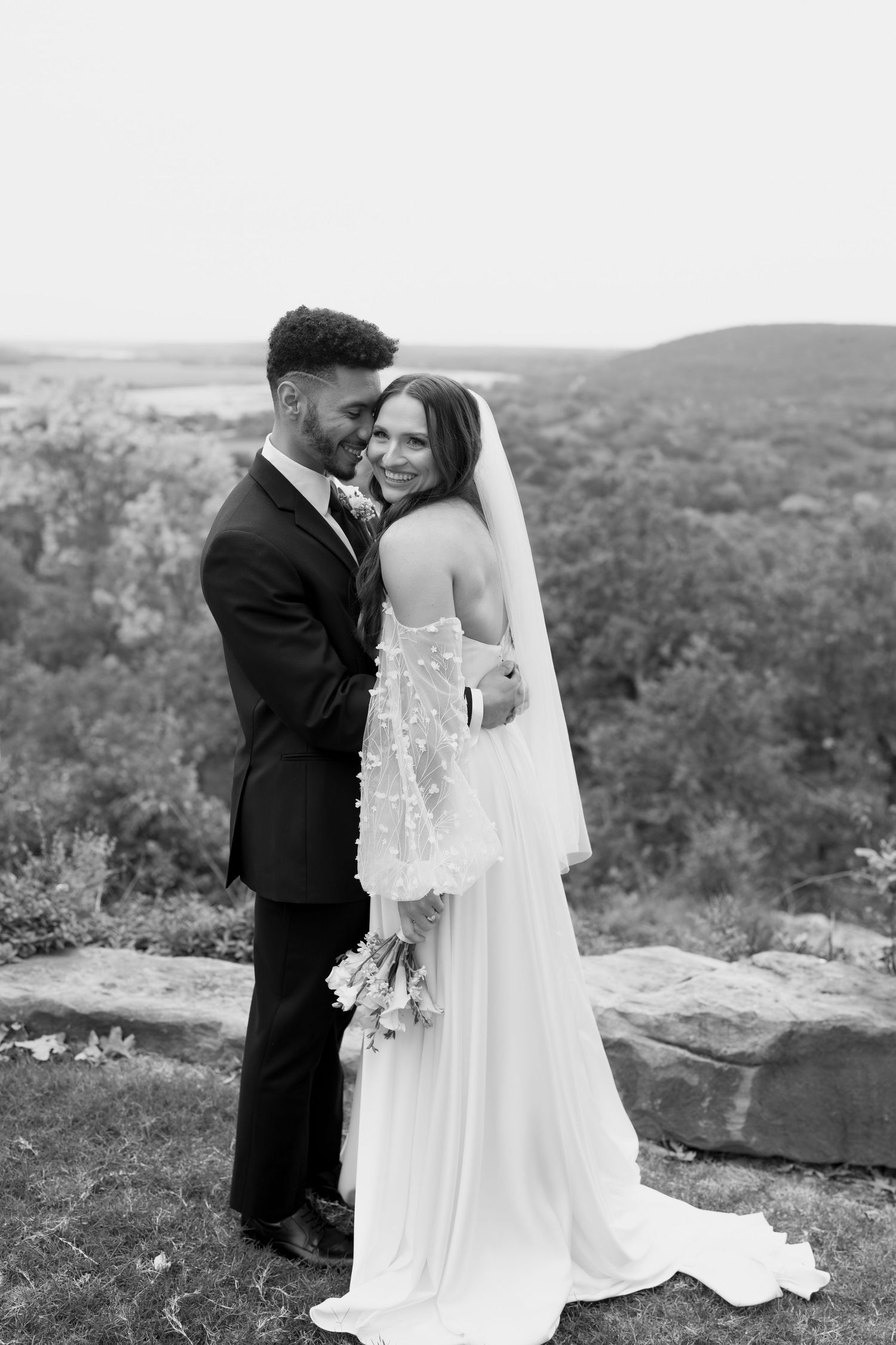 A collection of intimate wedding portraits captured against a dramatic hillside setting.