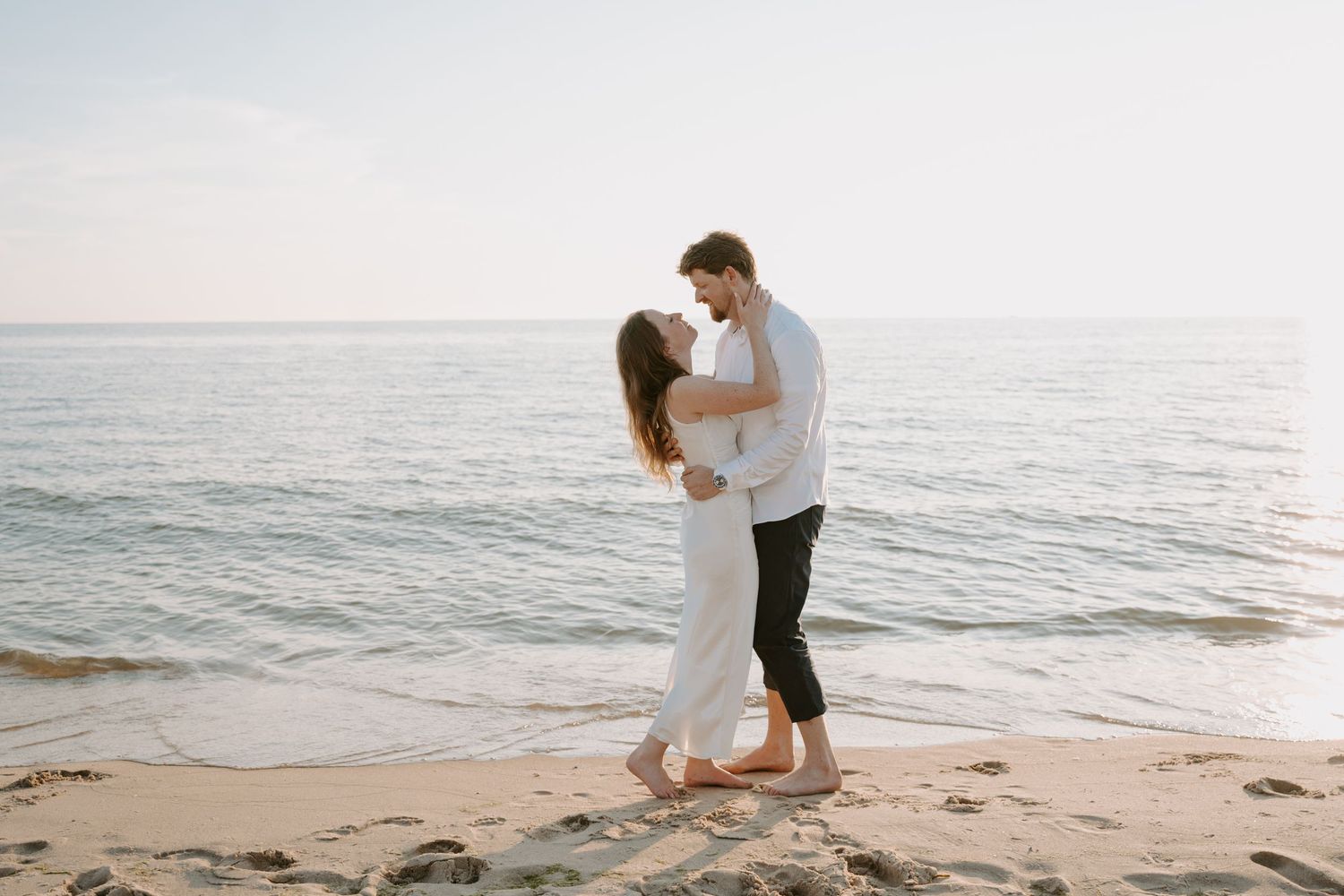 Romantic beach engagement photoshoot sequence at sunset.