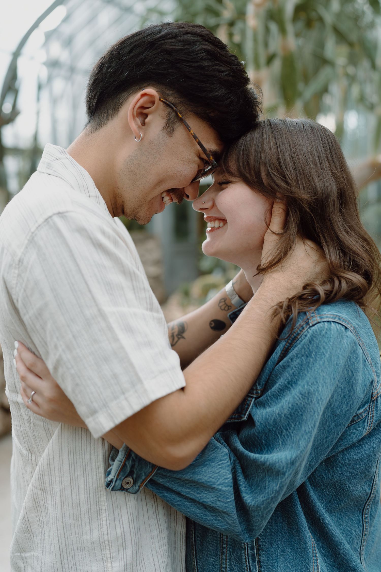 A couple in casual attire shares tender moments in a series of candid shots.