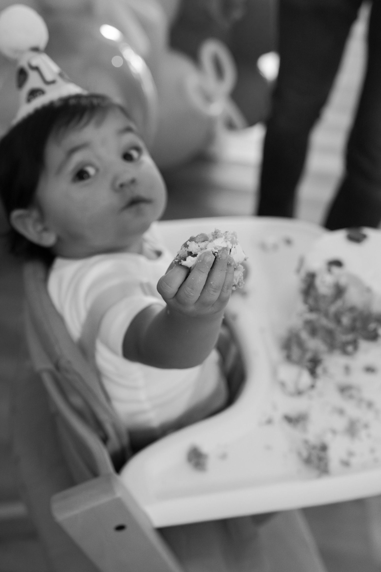 Black and white series of cake eating moments captured in sequence.