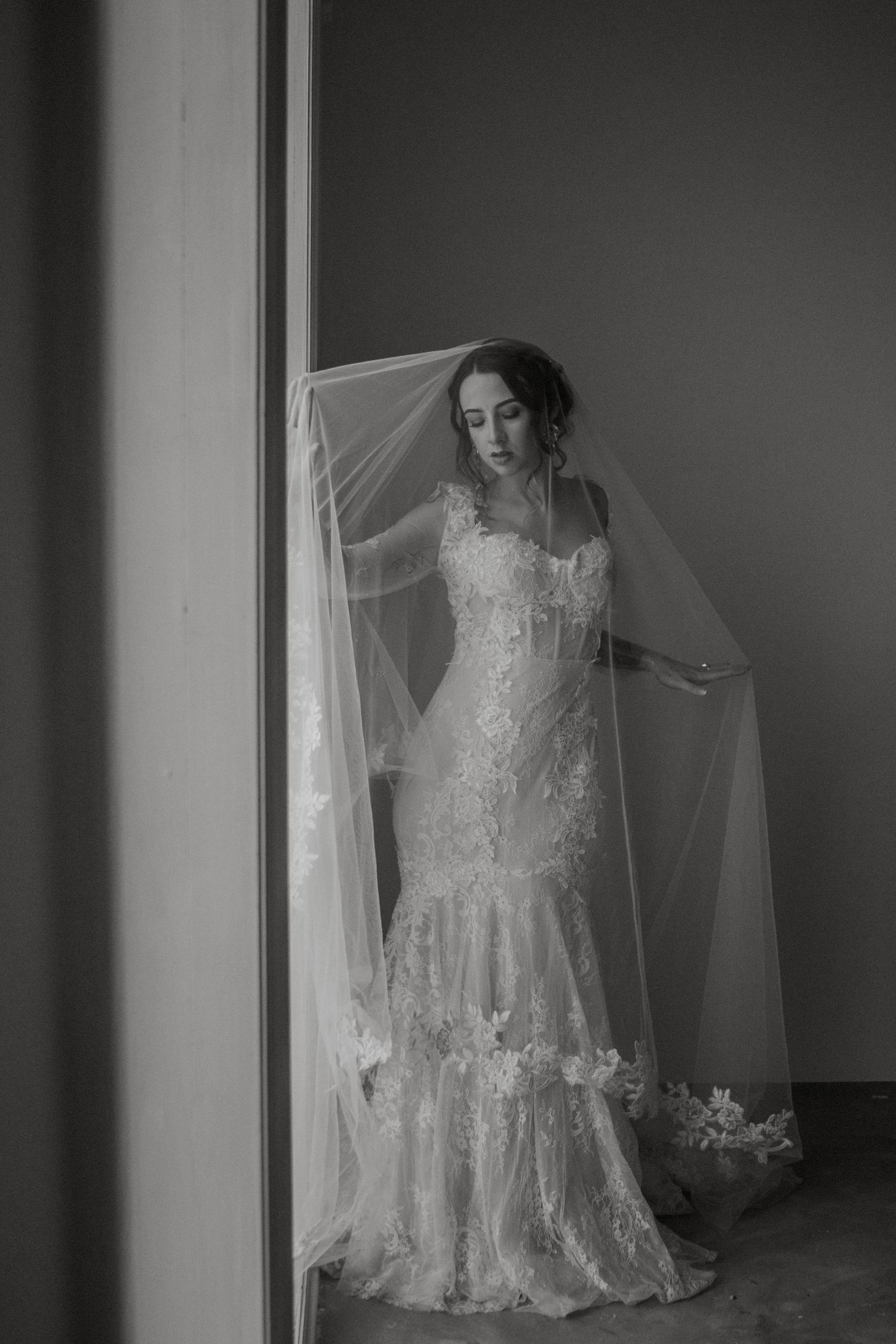Bridal photos with long veil by Emily Earll Photos