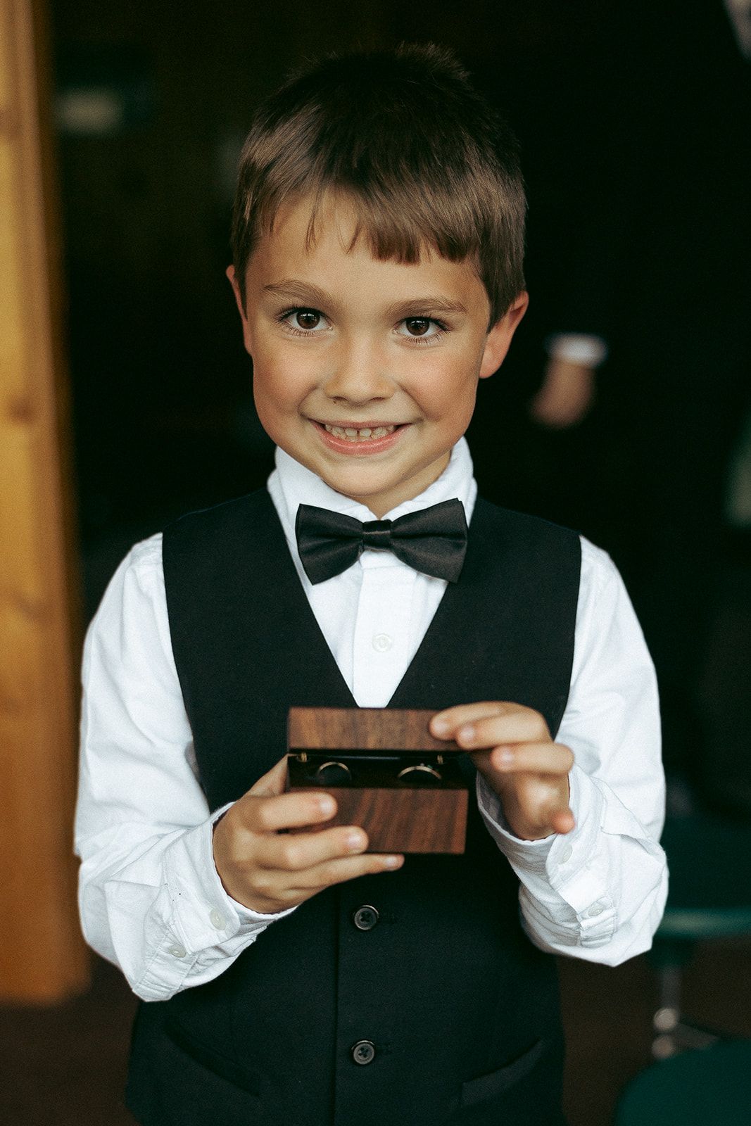 Emily and Noah's Wedding the ring box by NPE woodworks held by the ring bearer by Thomas and Co. Photography