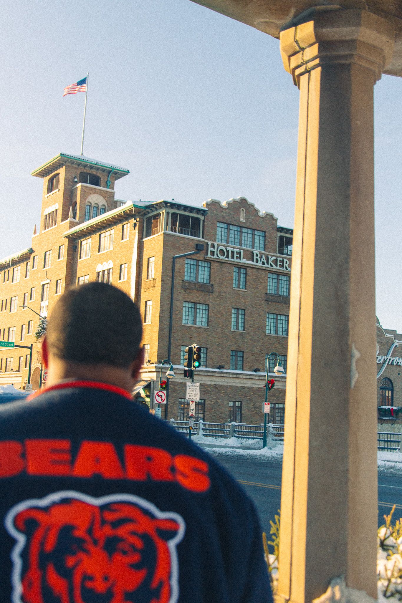 Vintage style photography, downtown engagement photos, bears jacket in downtown Chicago suburbs