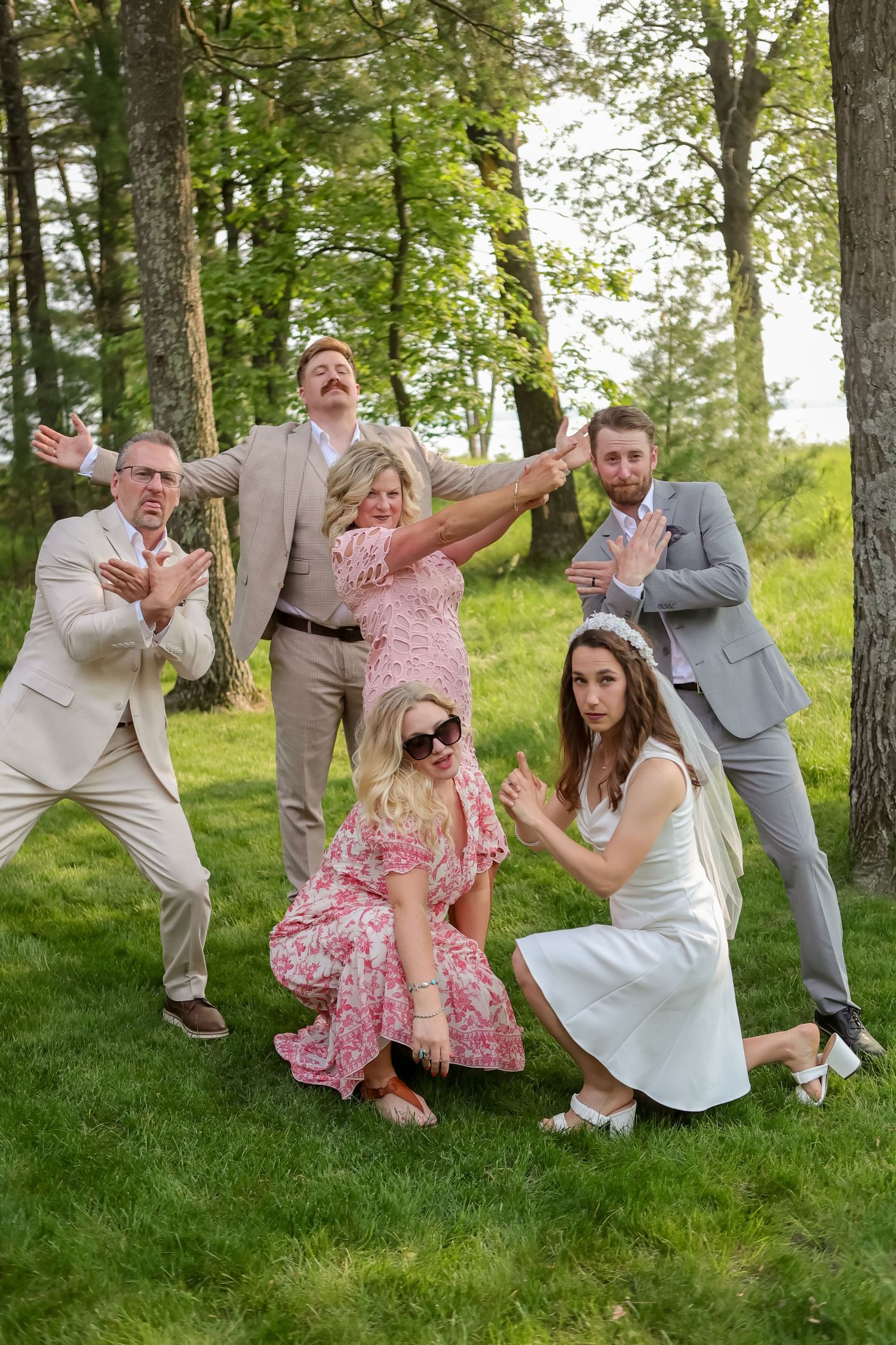 Fun family portraits, family photos at a wedding, family being goofy for wedding photos, Emily Earll Photos