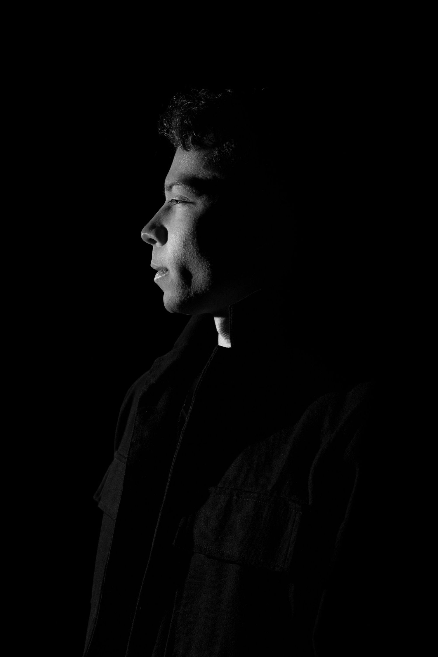 Dramatic black and white profile silhouettes shown in sequence against dark background.