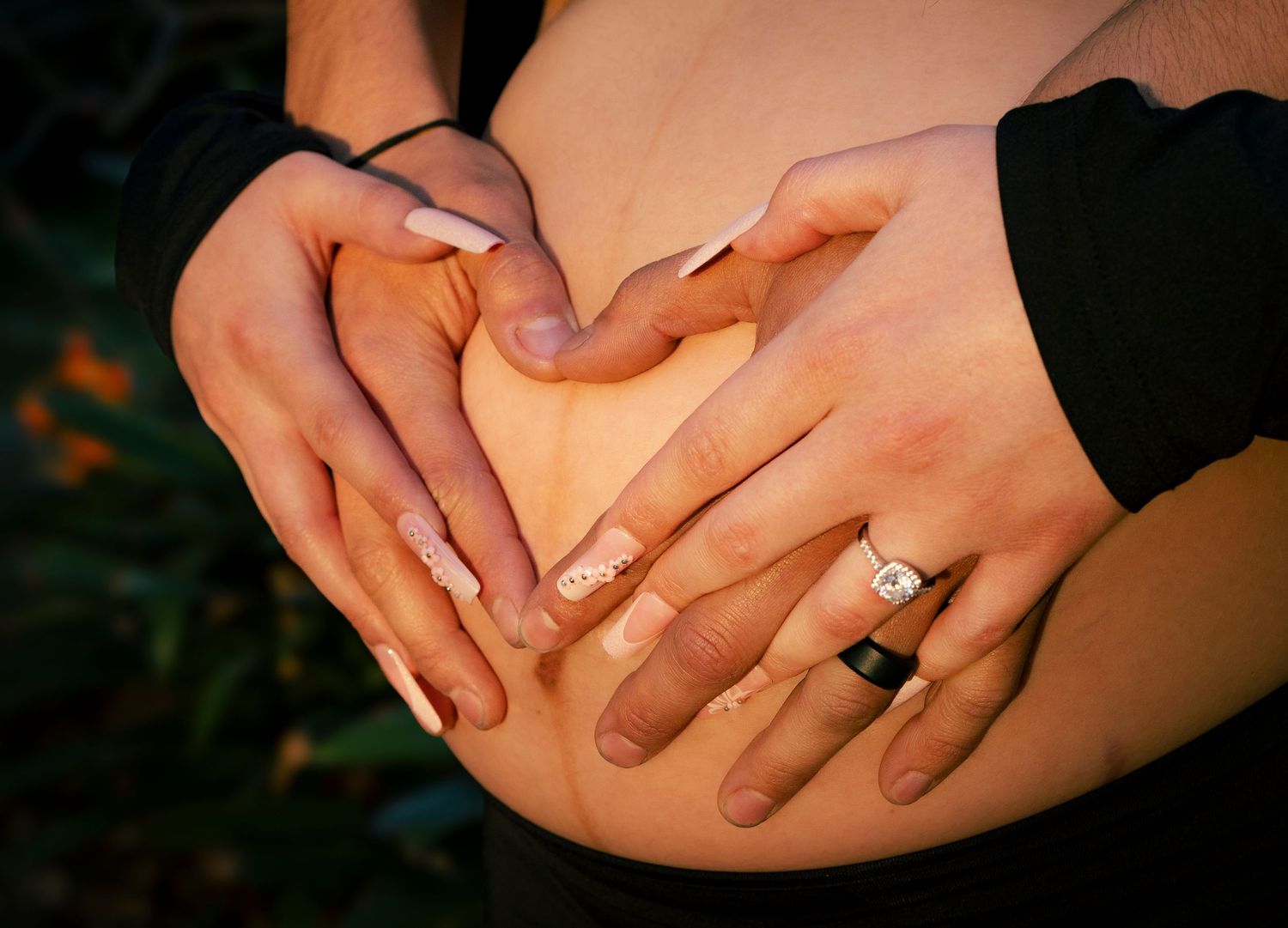 Multiple artistic shots of hands displaying engagement rings.