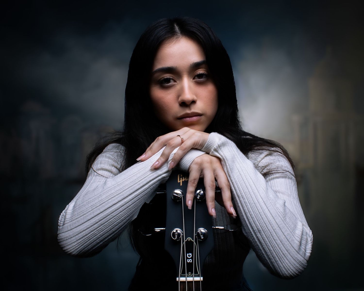 Artistic portrait series showing different moods and poses with a violin against a dark dramatic background.
