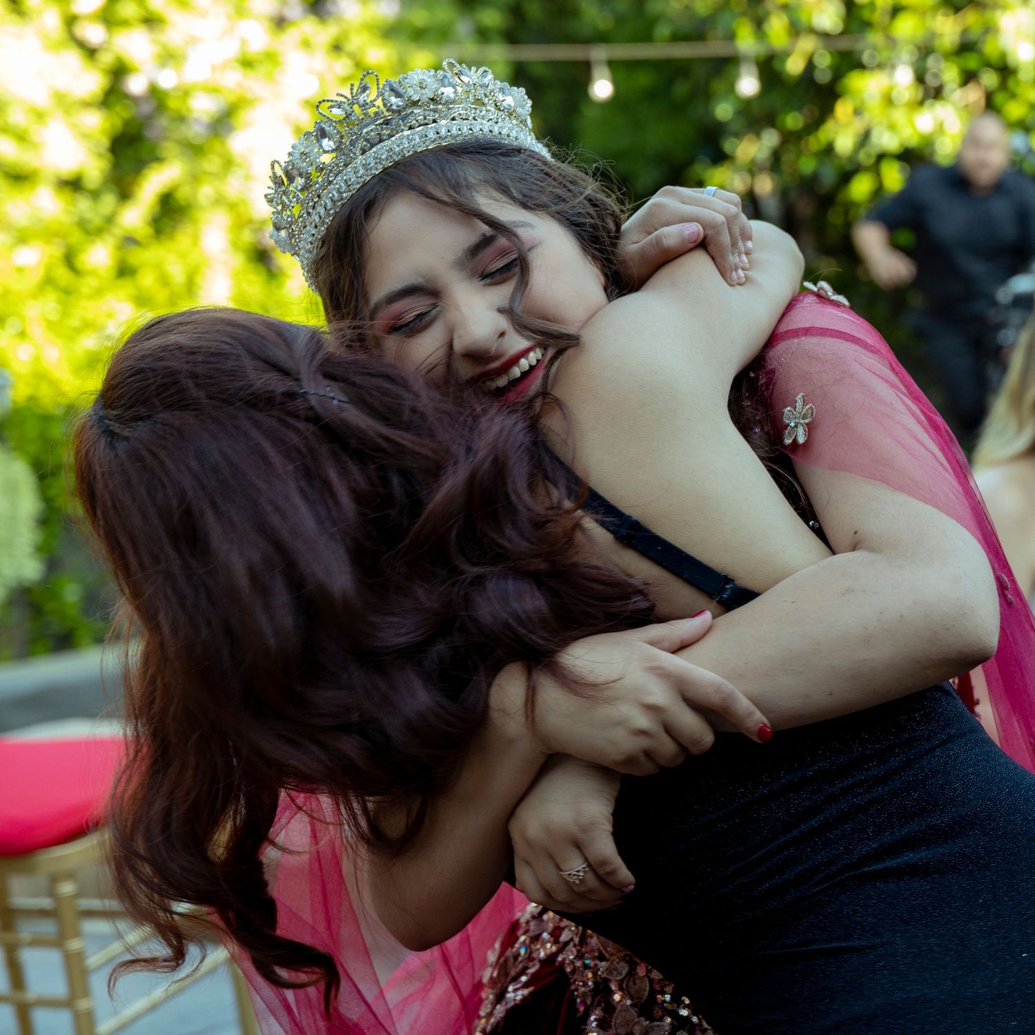 Happy celebration moments shared in a sunlit garden setting.