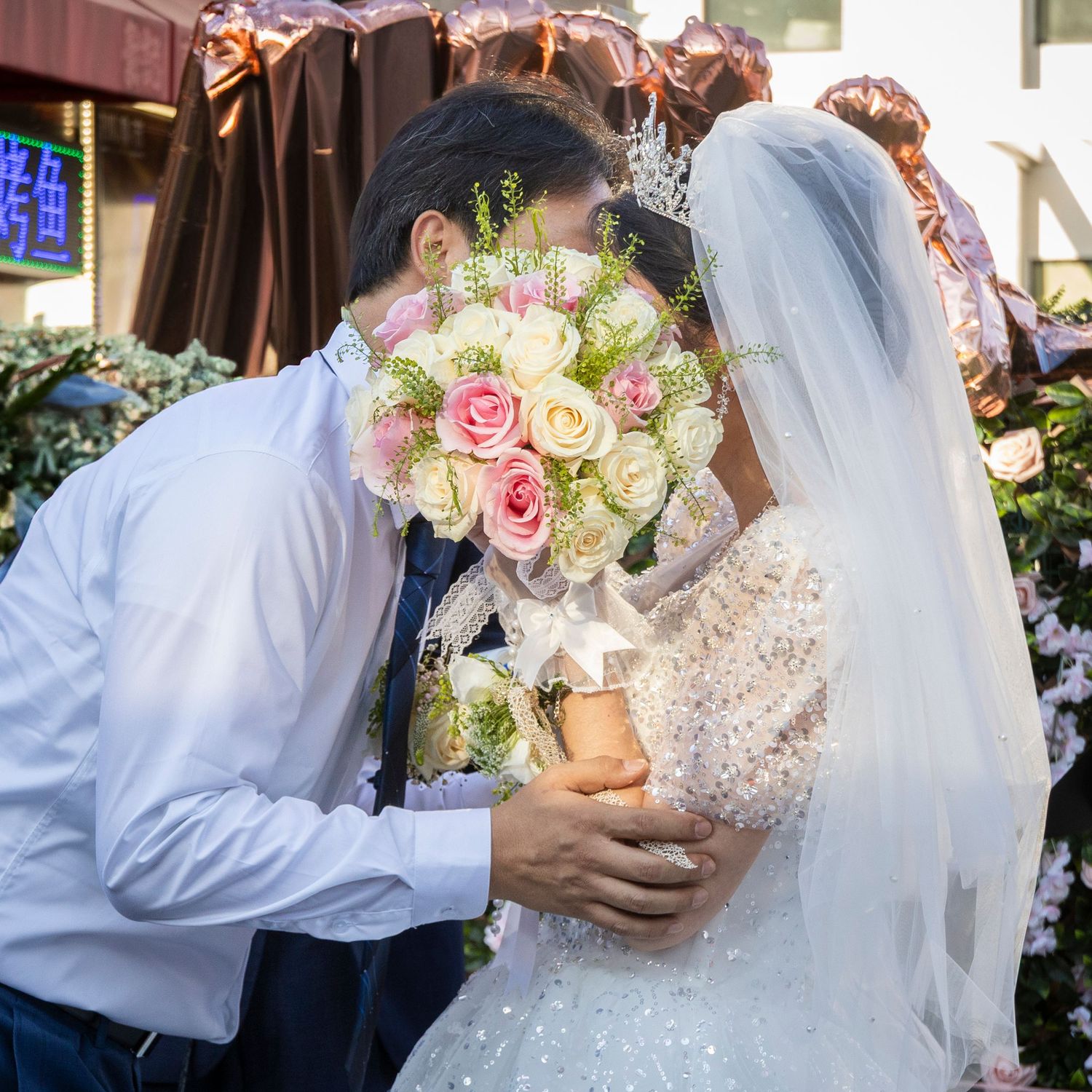 Wedding couple sharing an intimate moment during their ceremony.