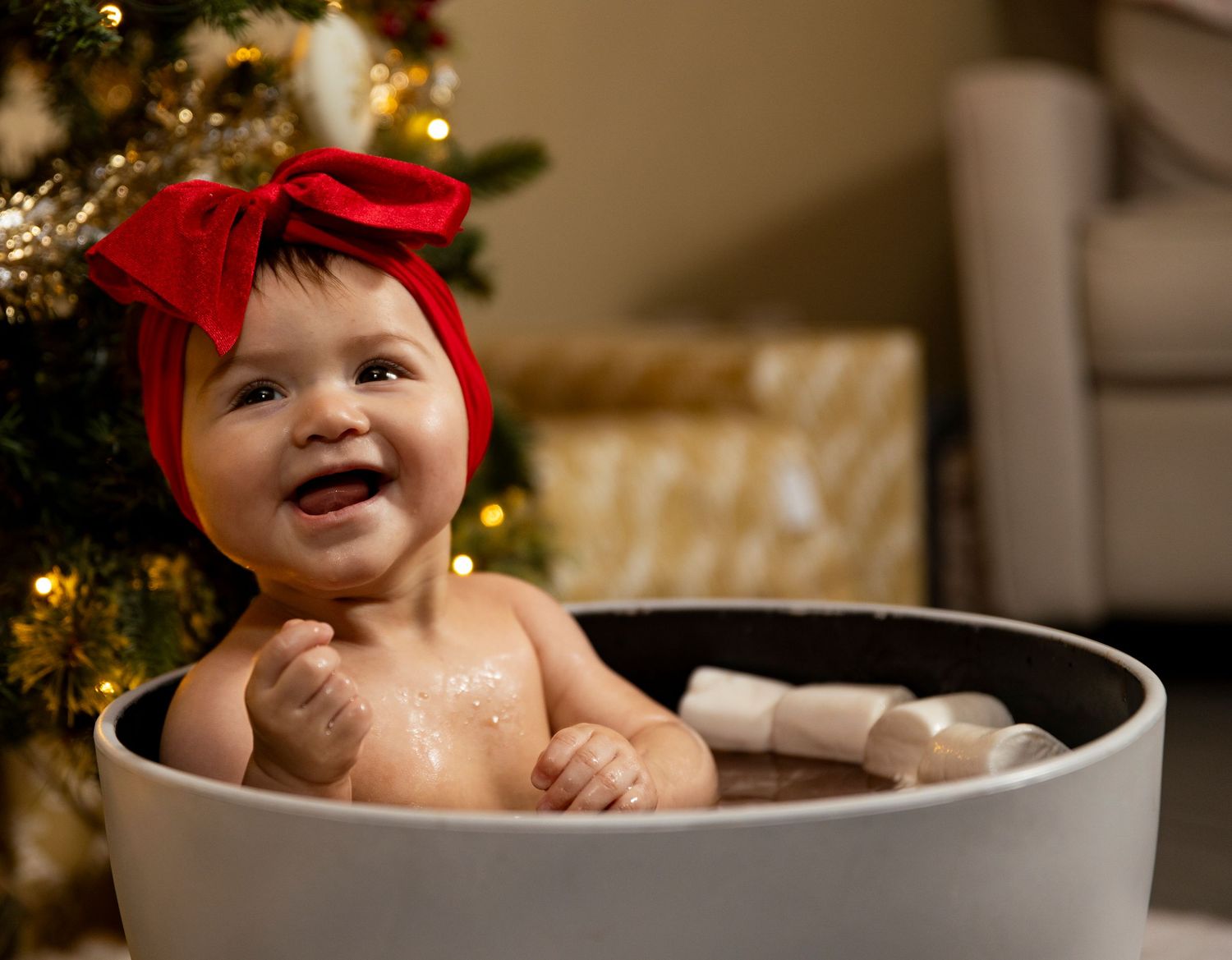 Holiday photo scene with large white ceramic mug and festive Christmas decor.