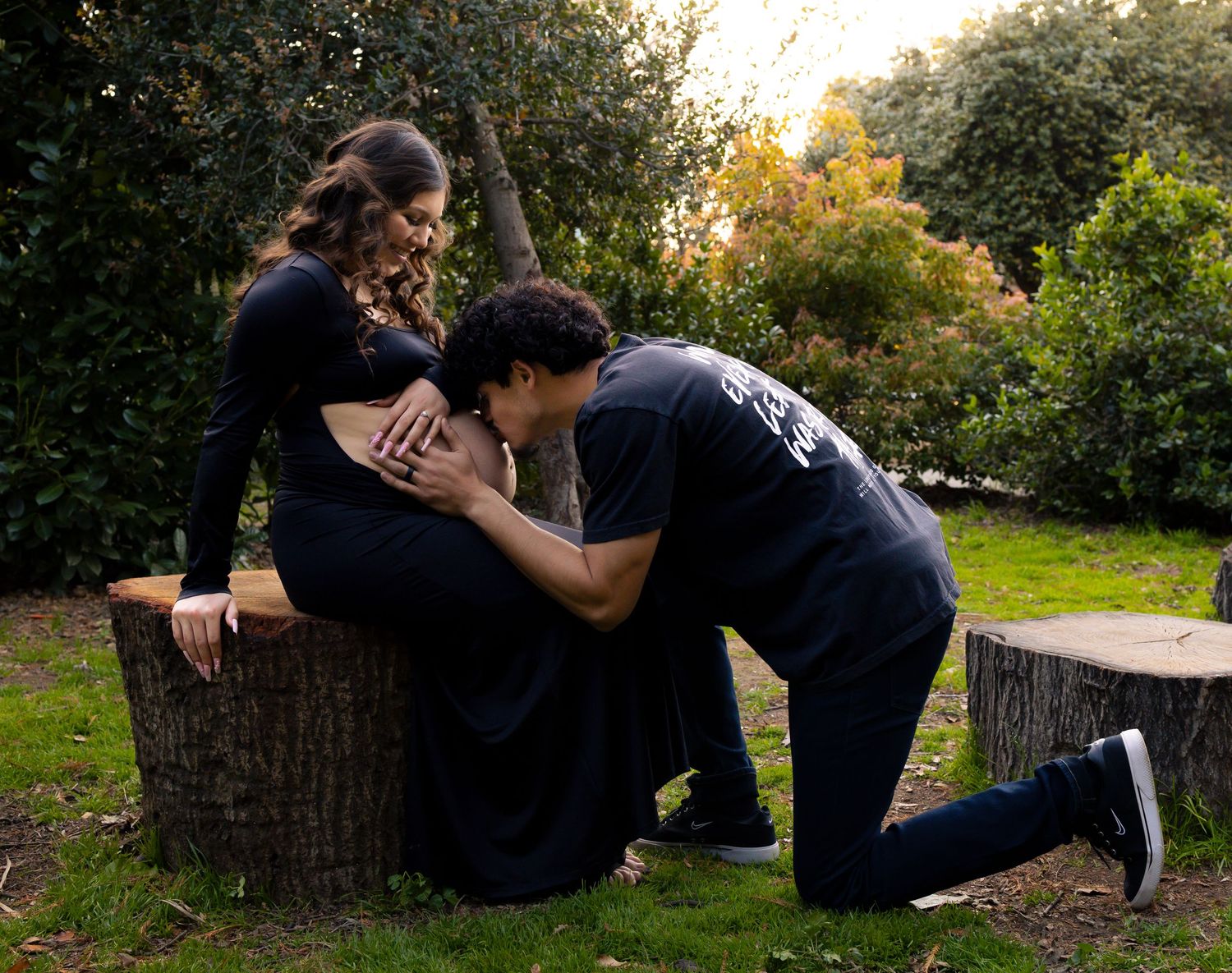 Playful outdoor photoshoot sequence showing couple interacting on garden path.