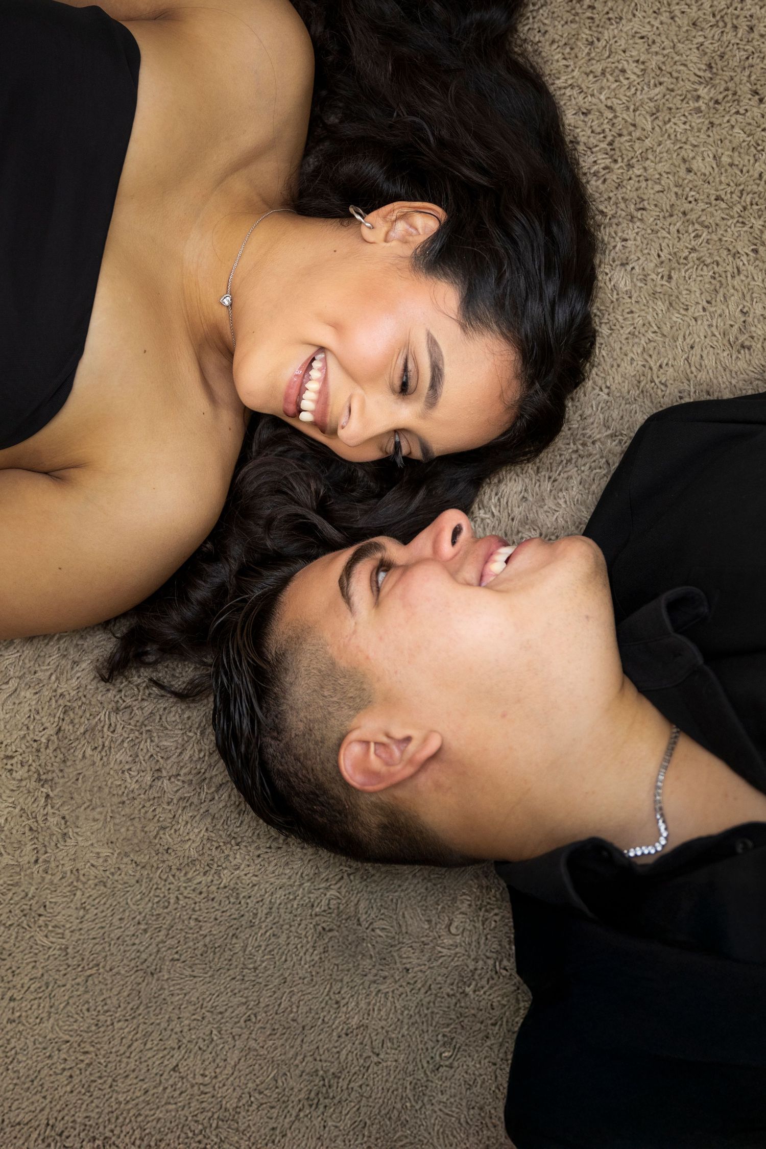 Artistic lying down portrait session capturing intimate moments and expressions.