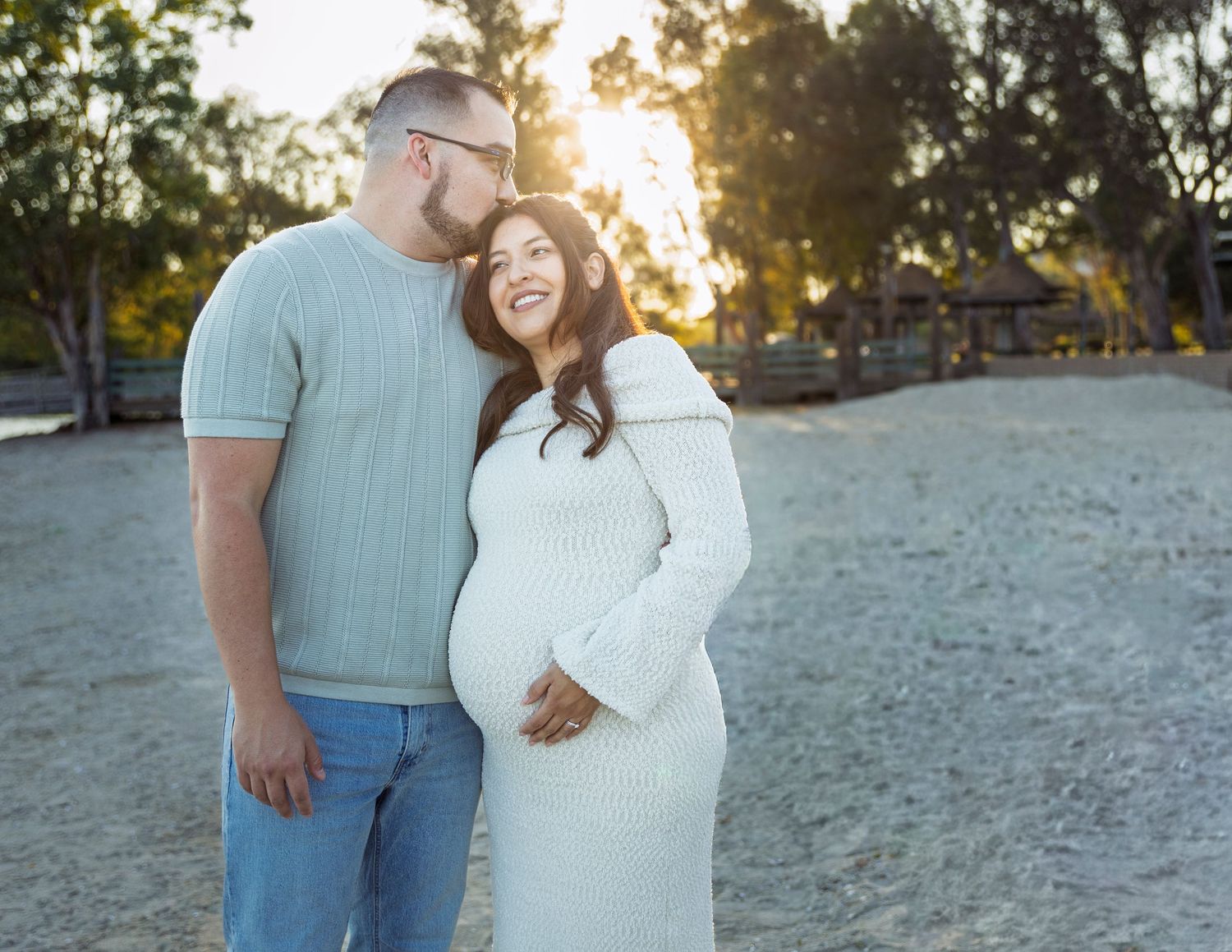 A lovely outdoor engagement photoshoot at sunset on a natural backdrop.