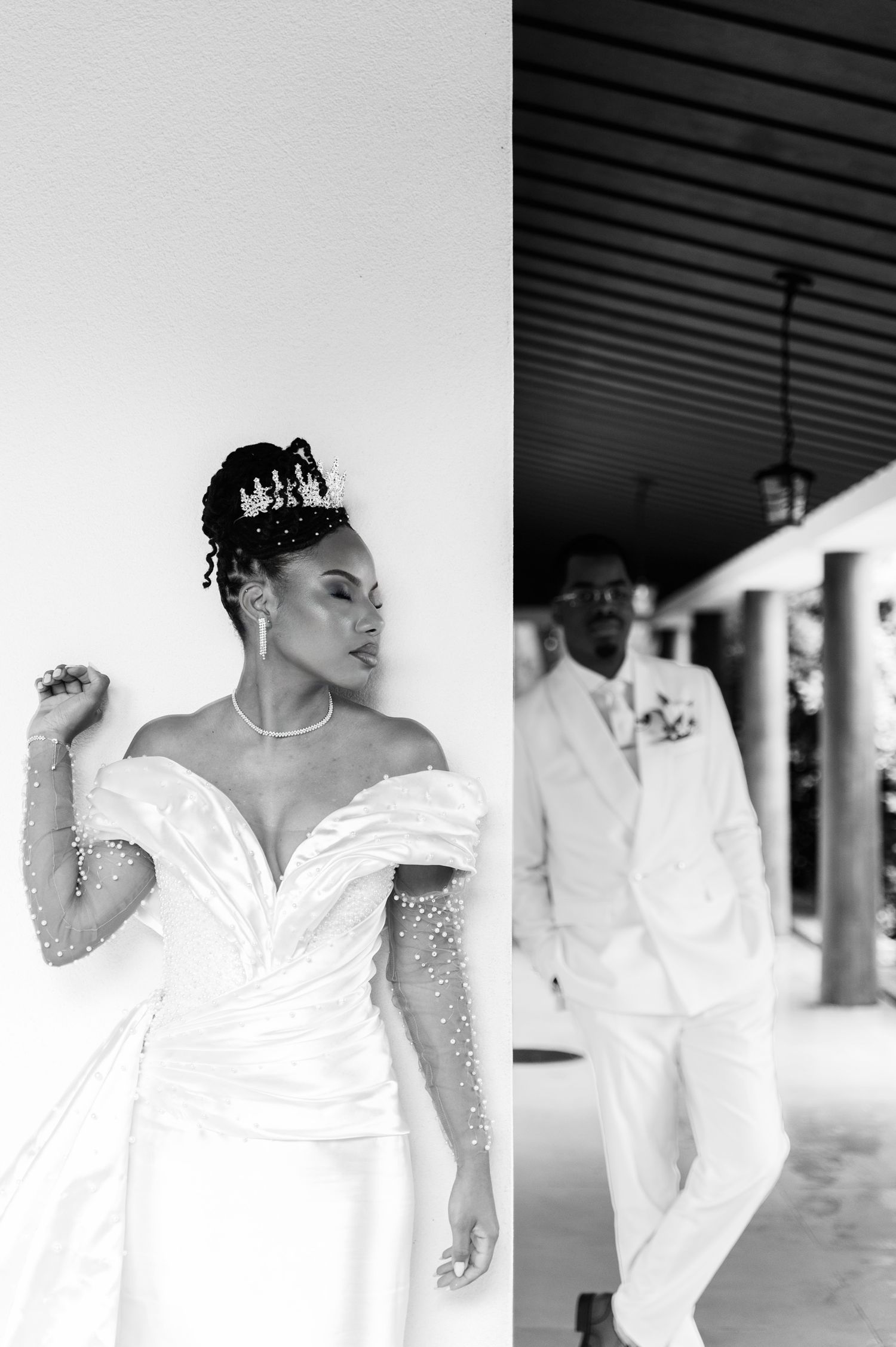 Black and white split photo of elegant bride in pearl wedding gown with crown and groom in white suit.