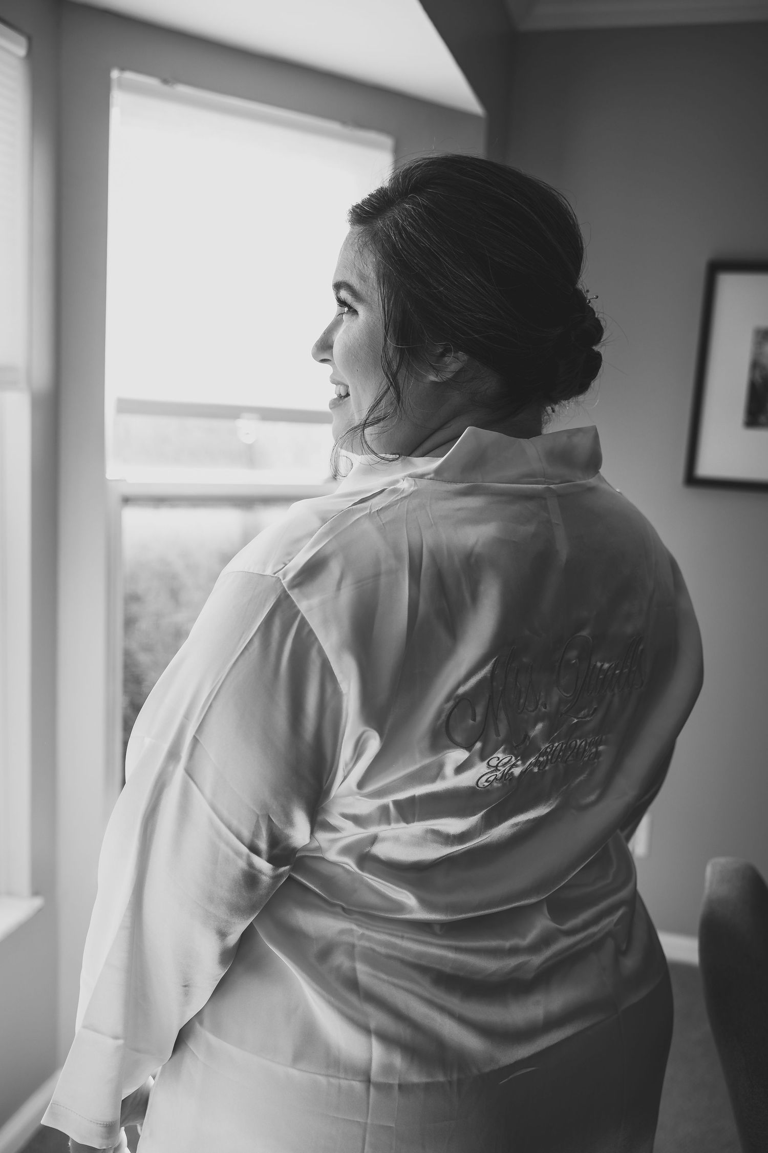 Black and white photo of matching getting ready robes with custom embroidery.