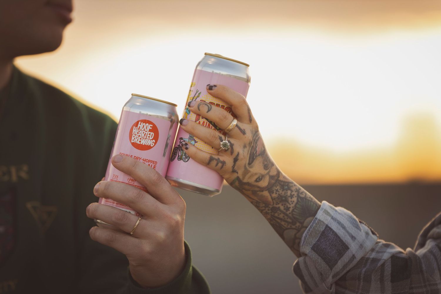 Drinks and snacks silhouetted against a warm sunset sky.