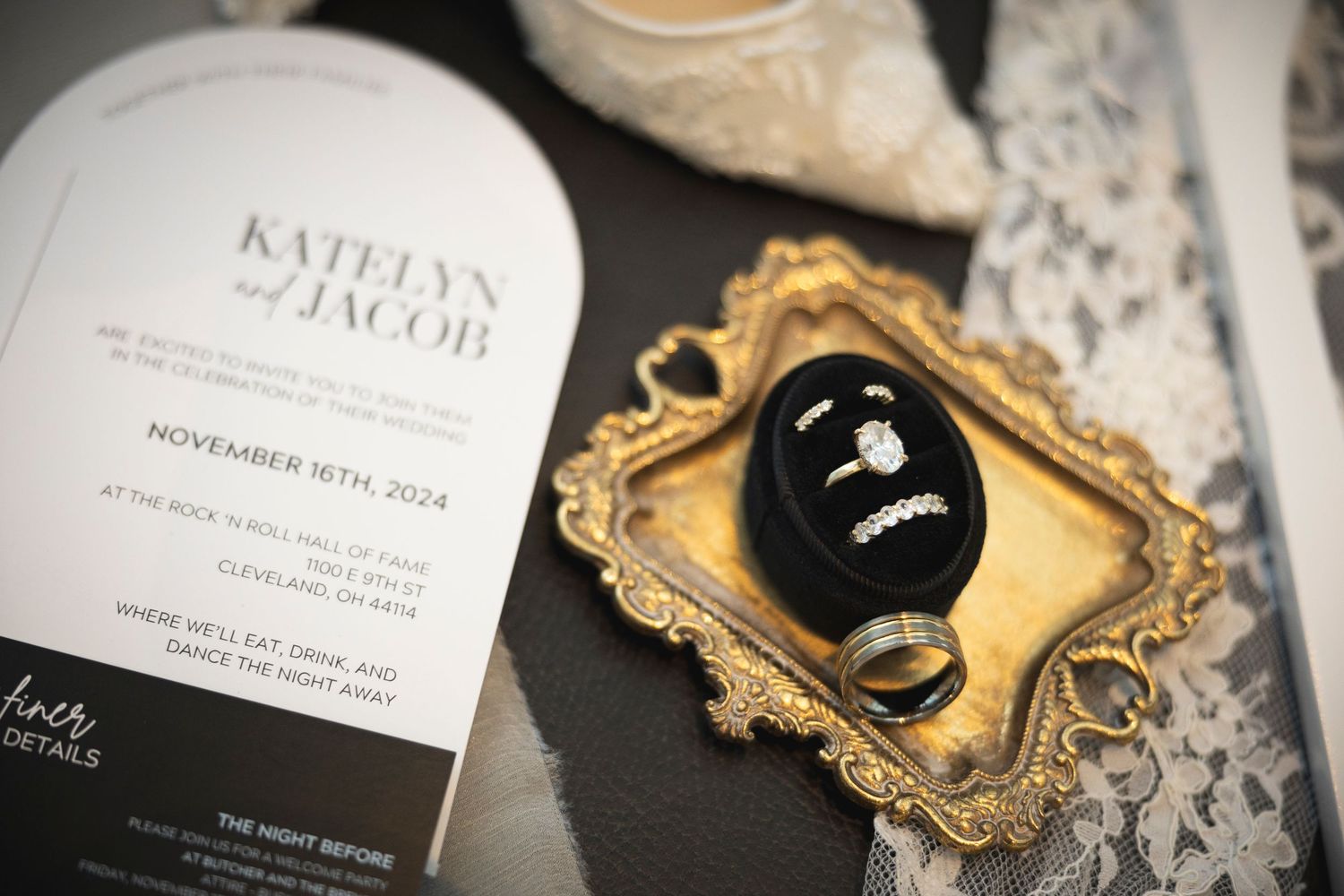 Wedding invitations and decorative details with elegant gold frames.