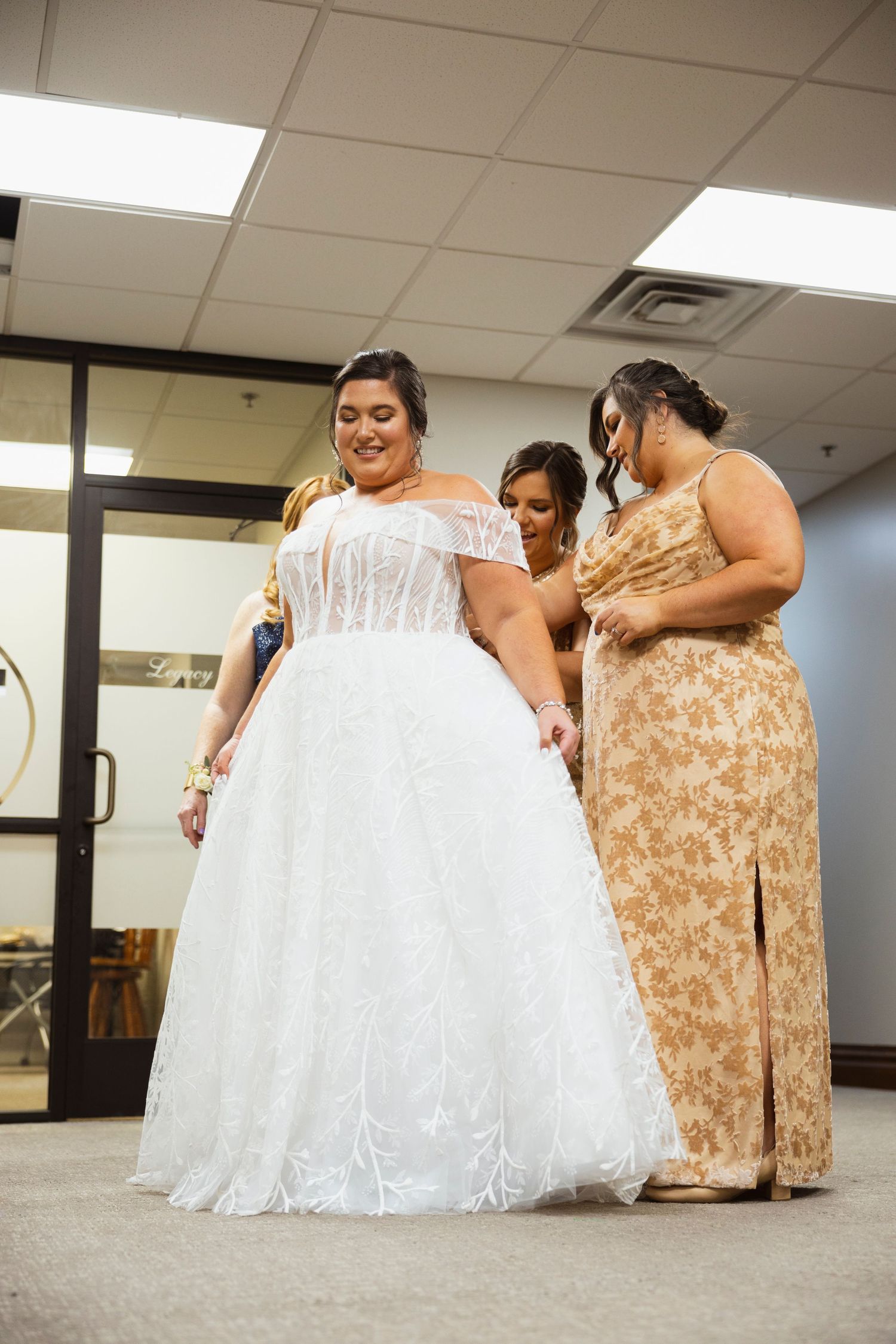 Wedding dress fittings and final adjustments in a bridal salon.