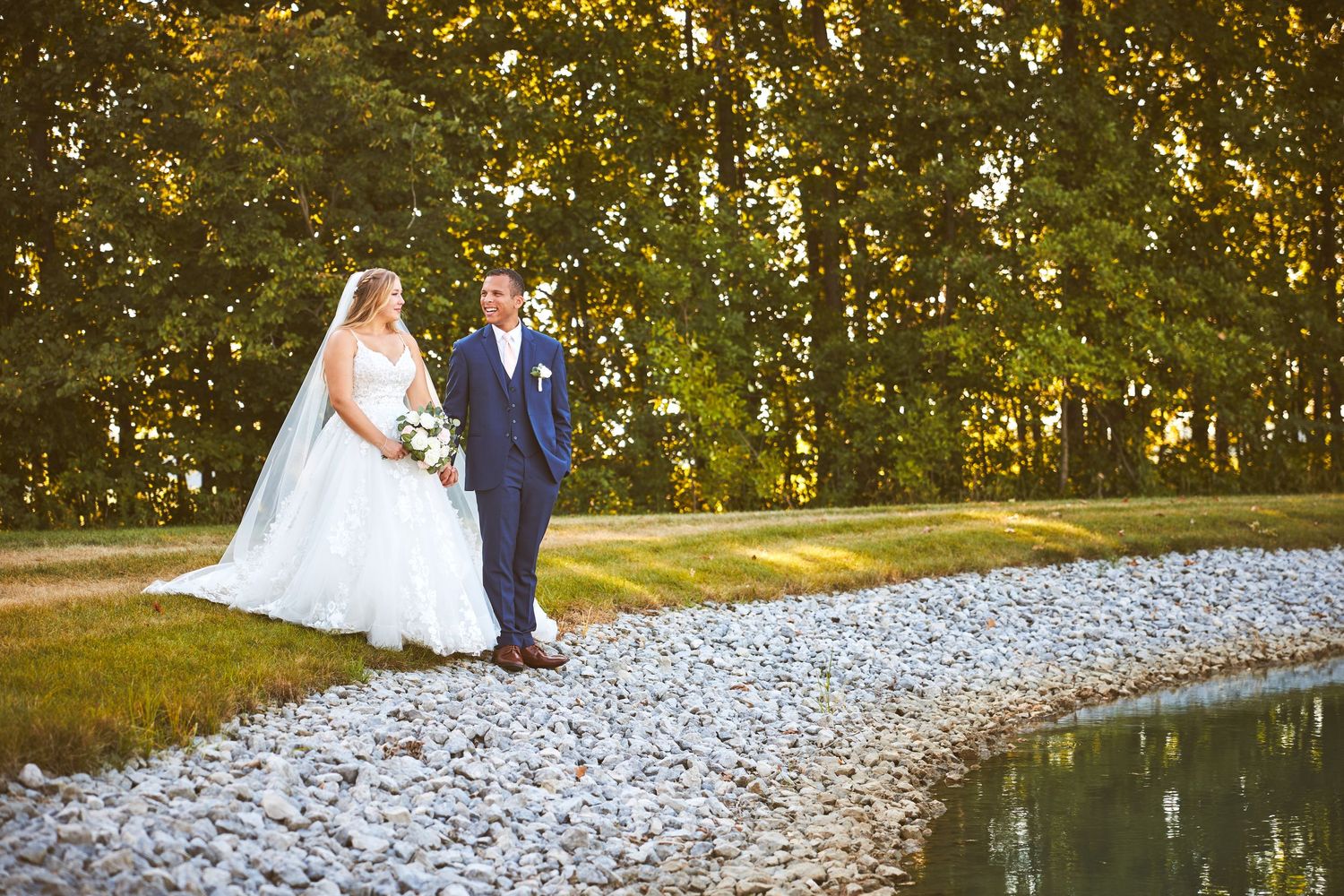 Beautiful outdoor wedding venue with white stone path and natural forest scenery.