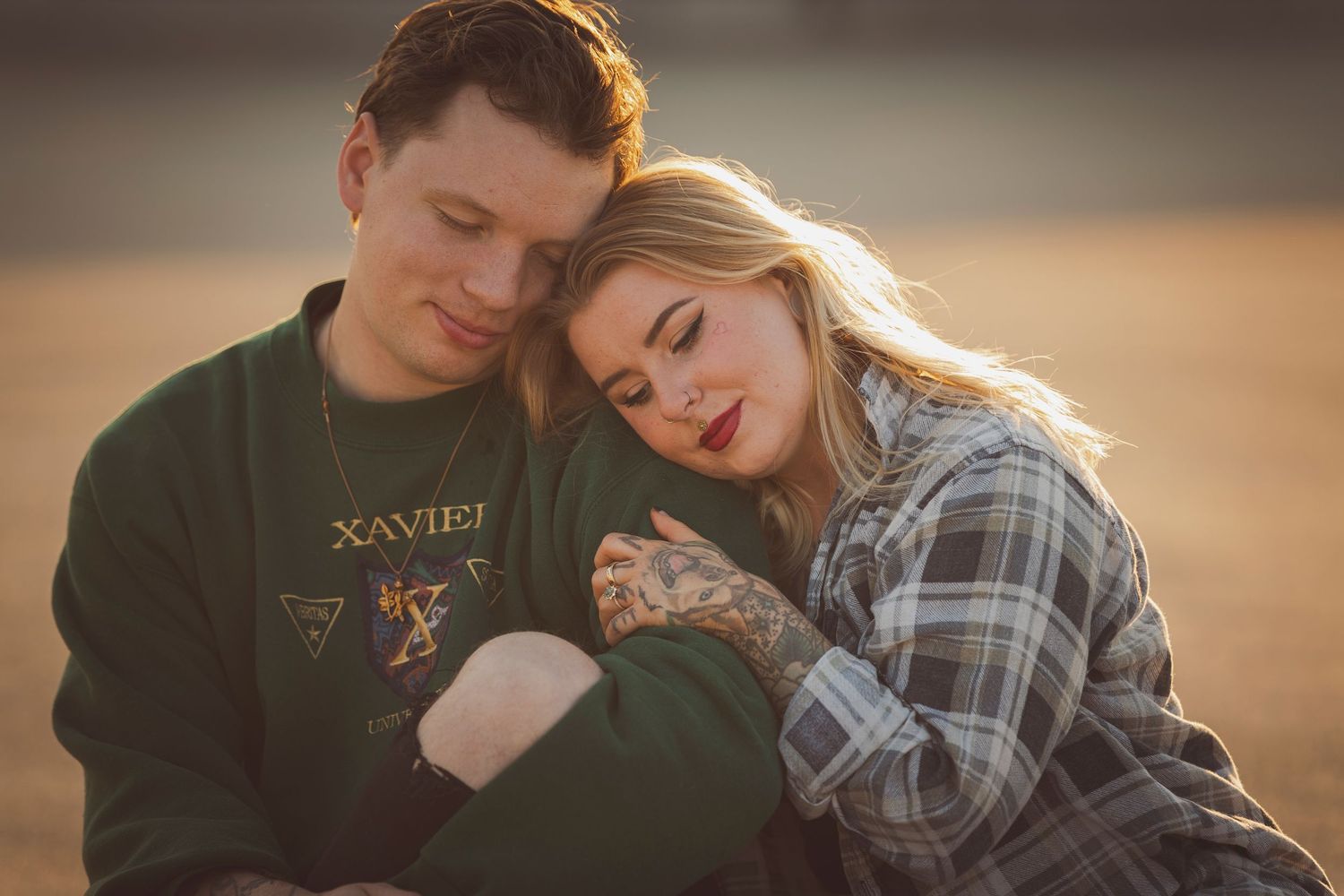 Couple shares tender moments during golden hour photoshoot.