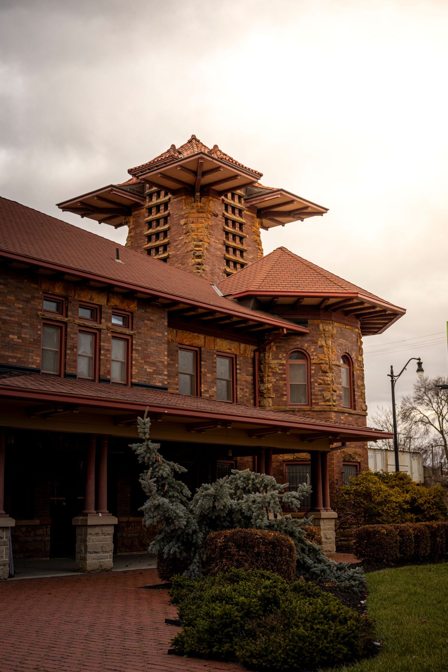 Prairie-style architecture building with dramatic overhanging eaves and stone details.