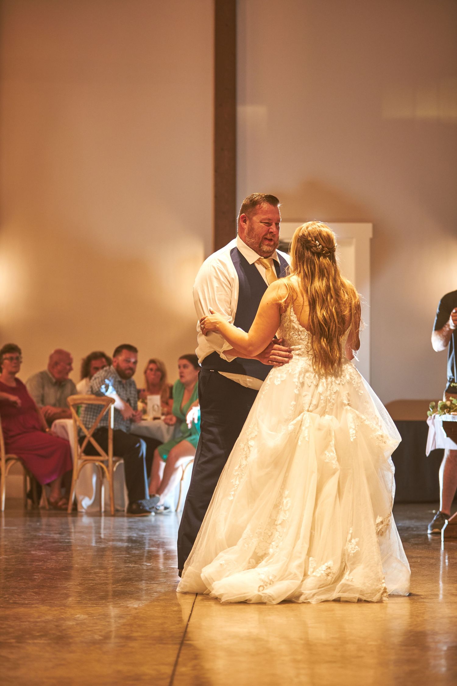 Wedding guests mingle and socialize during the reception celebration.