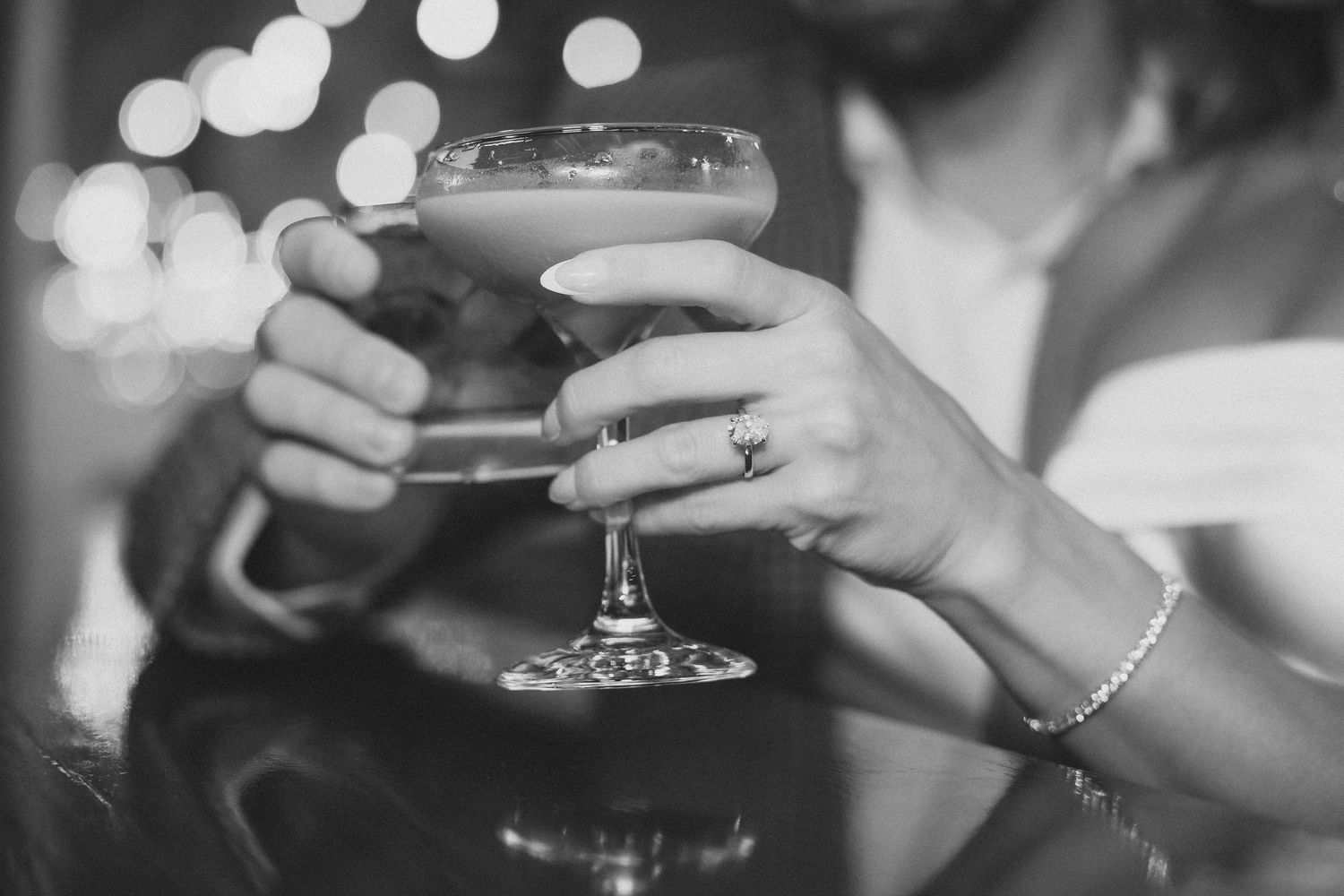 Close-up shot of champagne glasses with soft bokeh lighting effects.